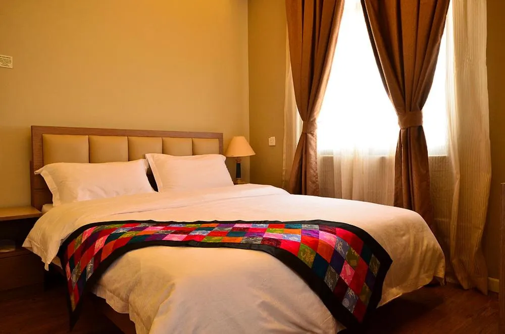 Bed in Jetty Suites Apartments