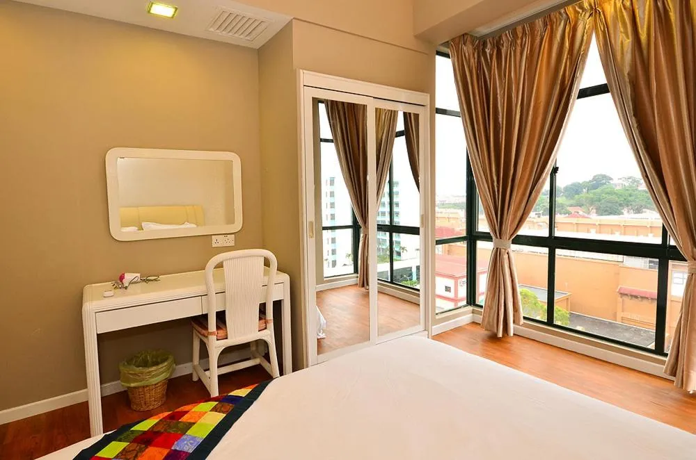Bed in Jetty Suites Apartments