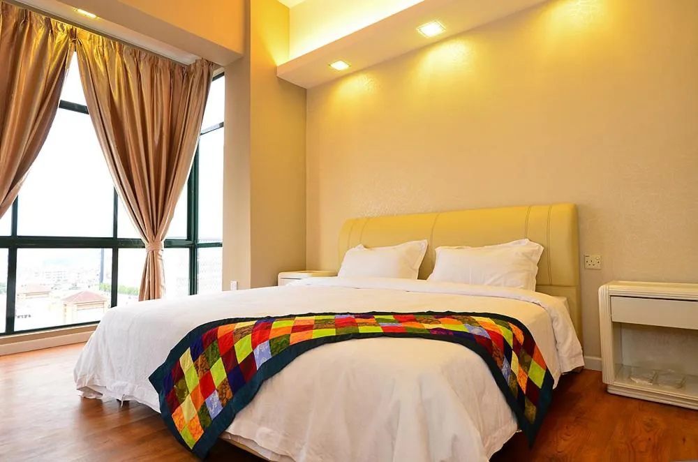 Bed in Jetty Suites Apartments