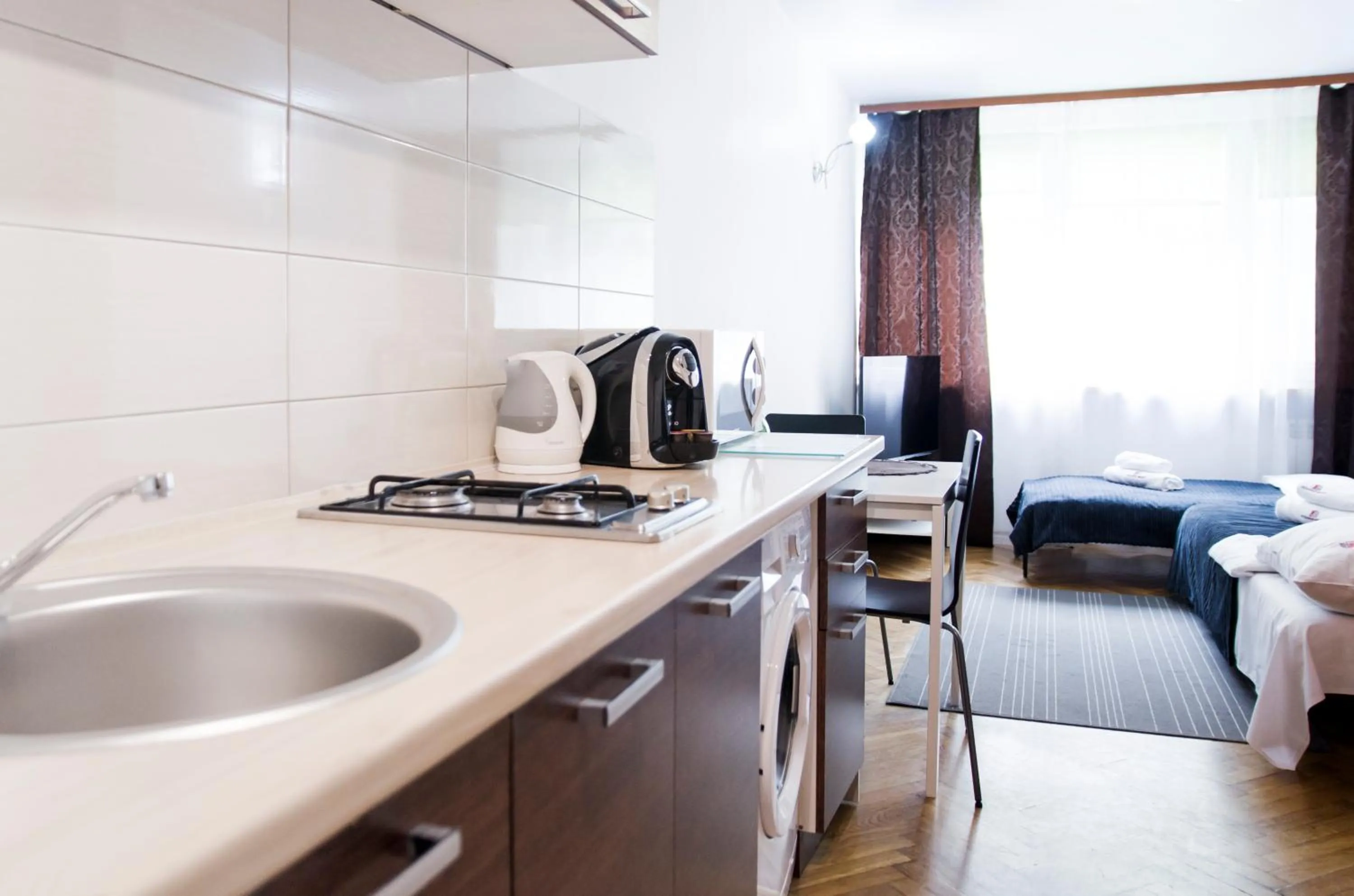 Coffee/tea facilities, Bed in Hosapartments City Center