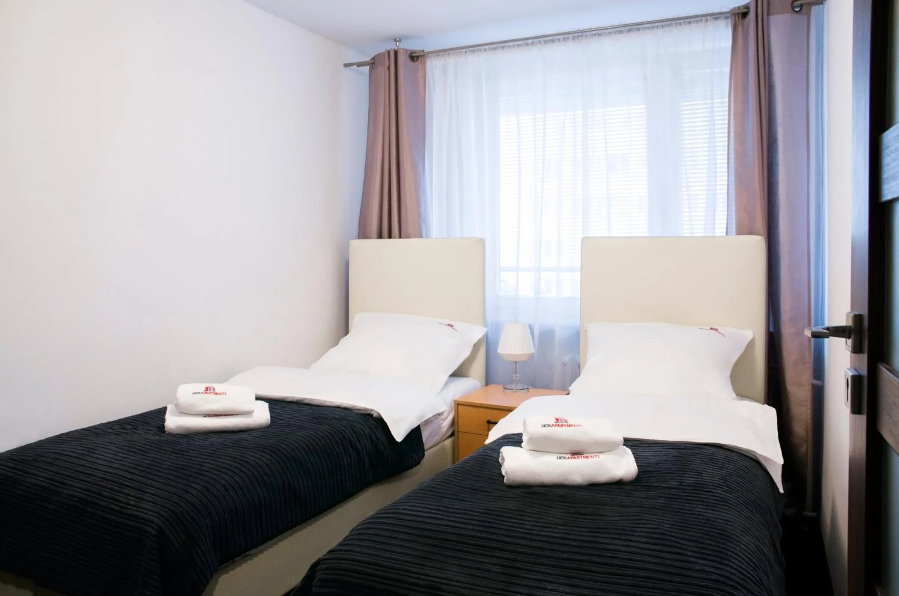 Photo of the whole room, Bed in Hosapartments City Center