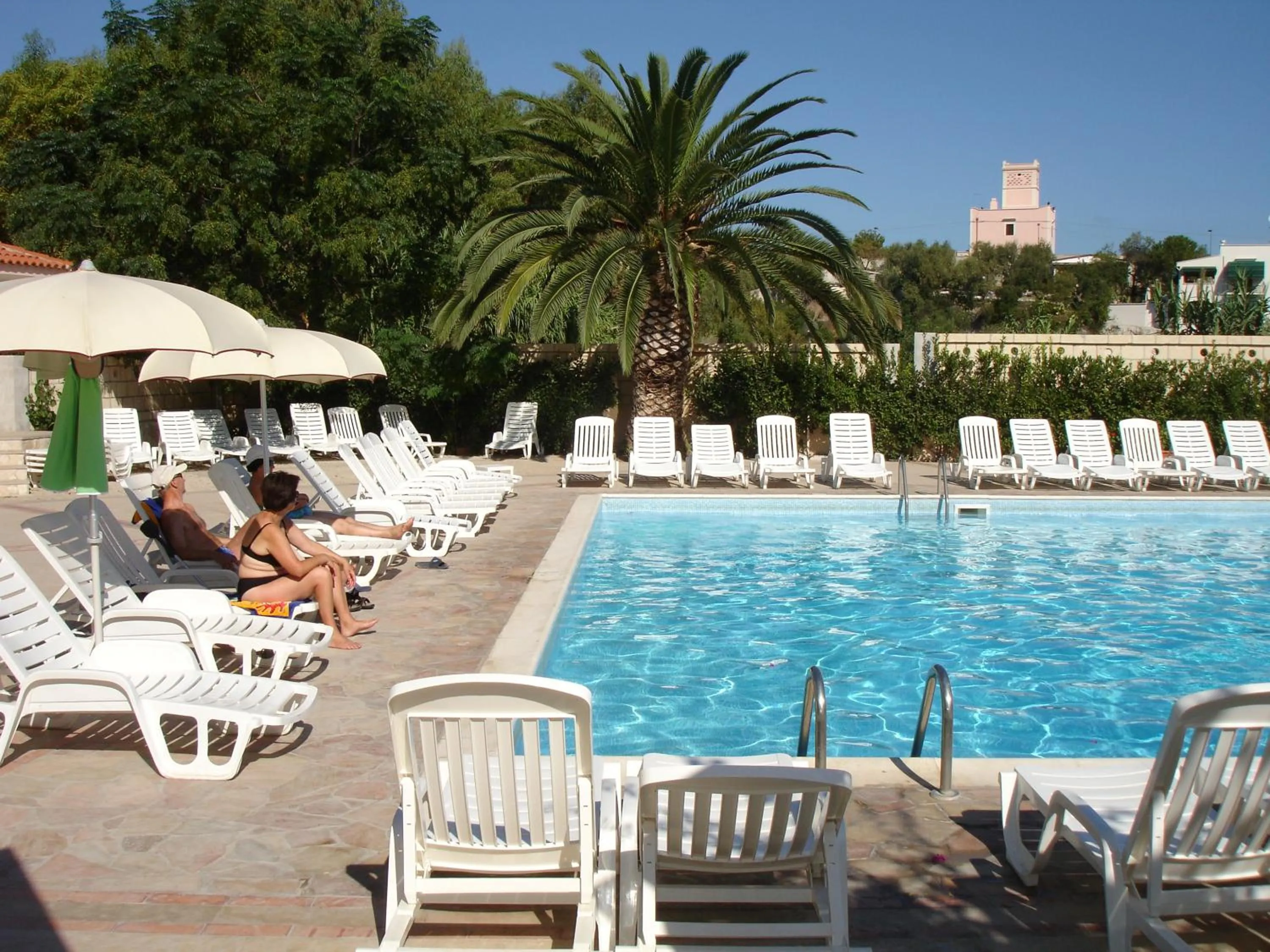 Swimming pool in Baia Degli Aranci Suite & Apartments