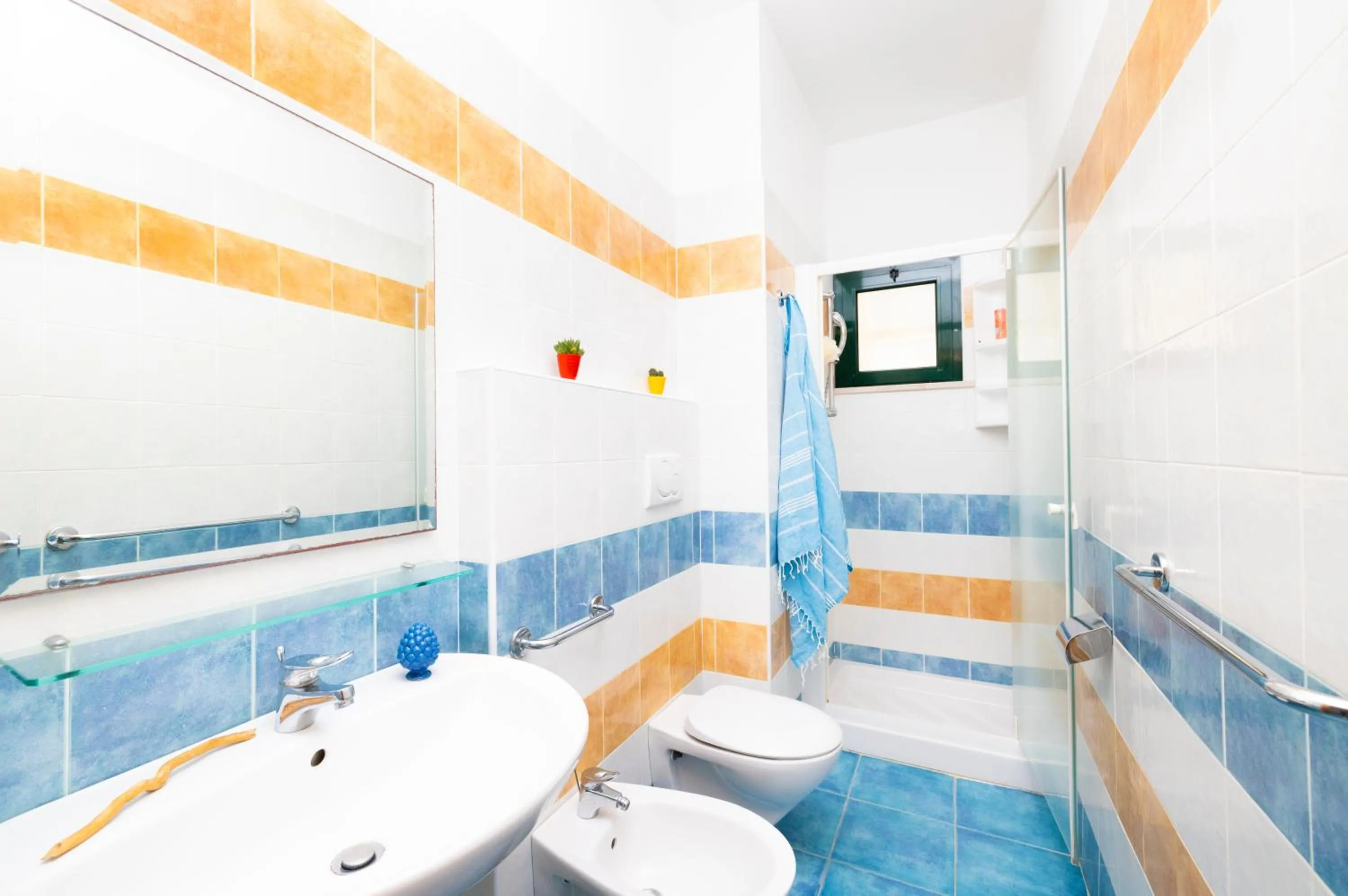 Bathroom in Baia Degli Aranci Suite & Apartments