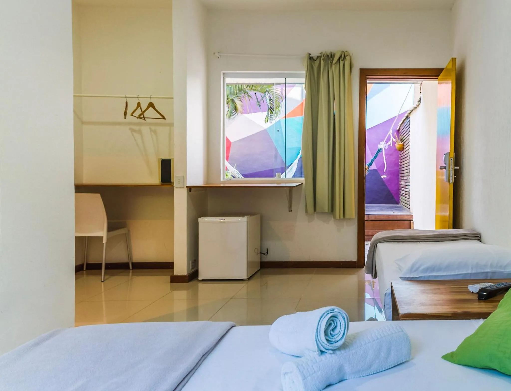 Bed in Pousada Tubes Maresias