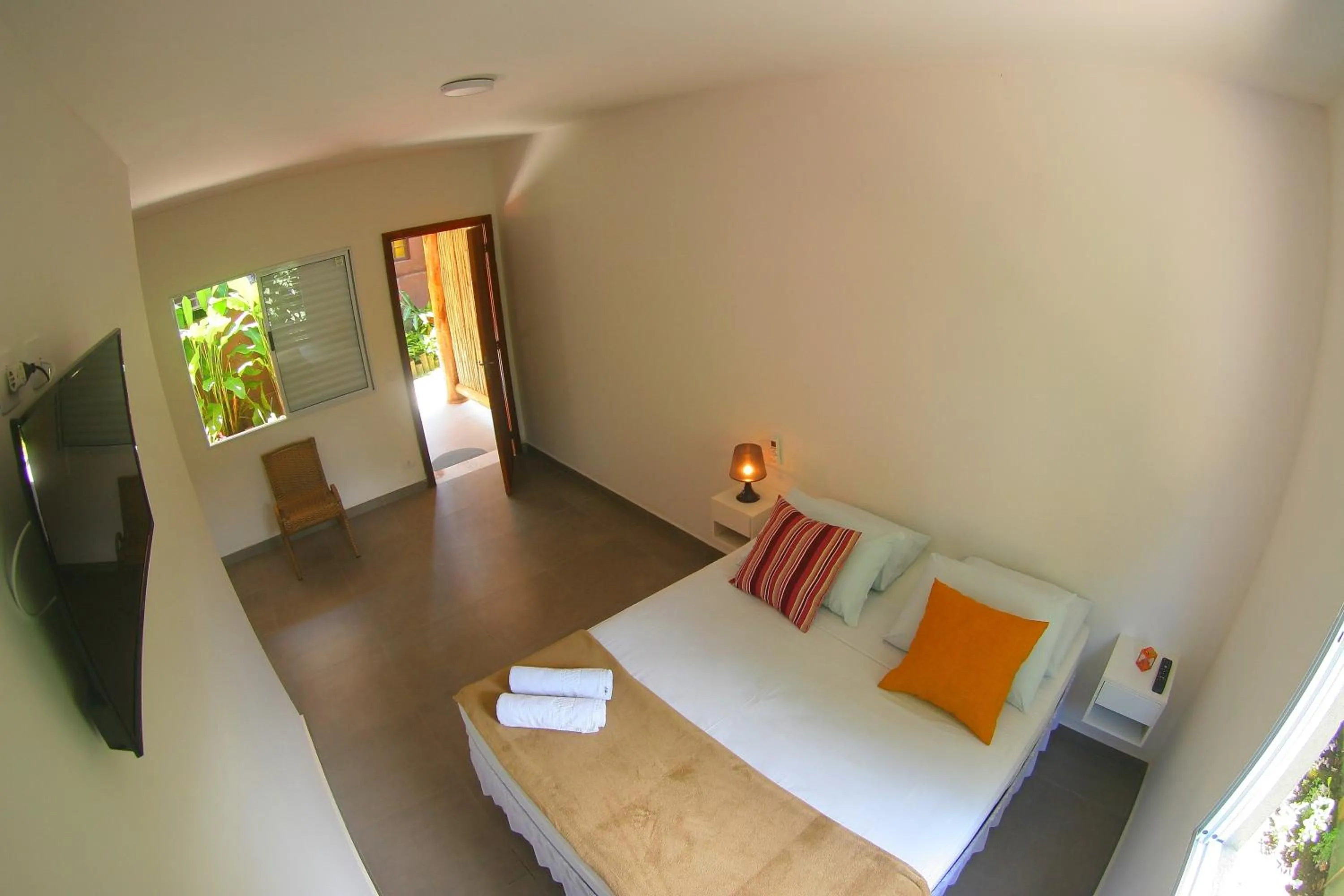 Bed in Pousada Tubes Maresias