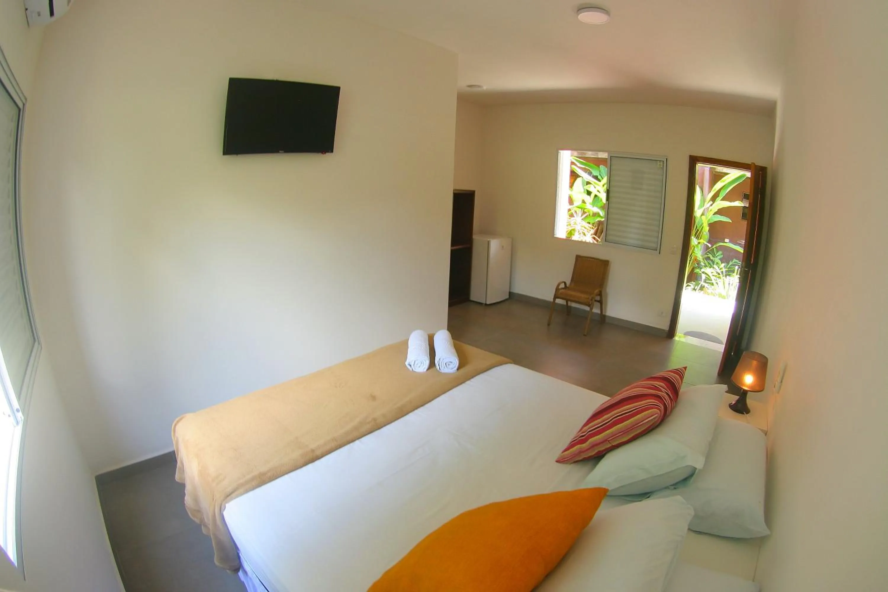 Bed in Pousada Tubes Maresias