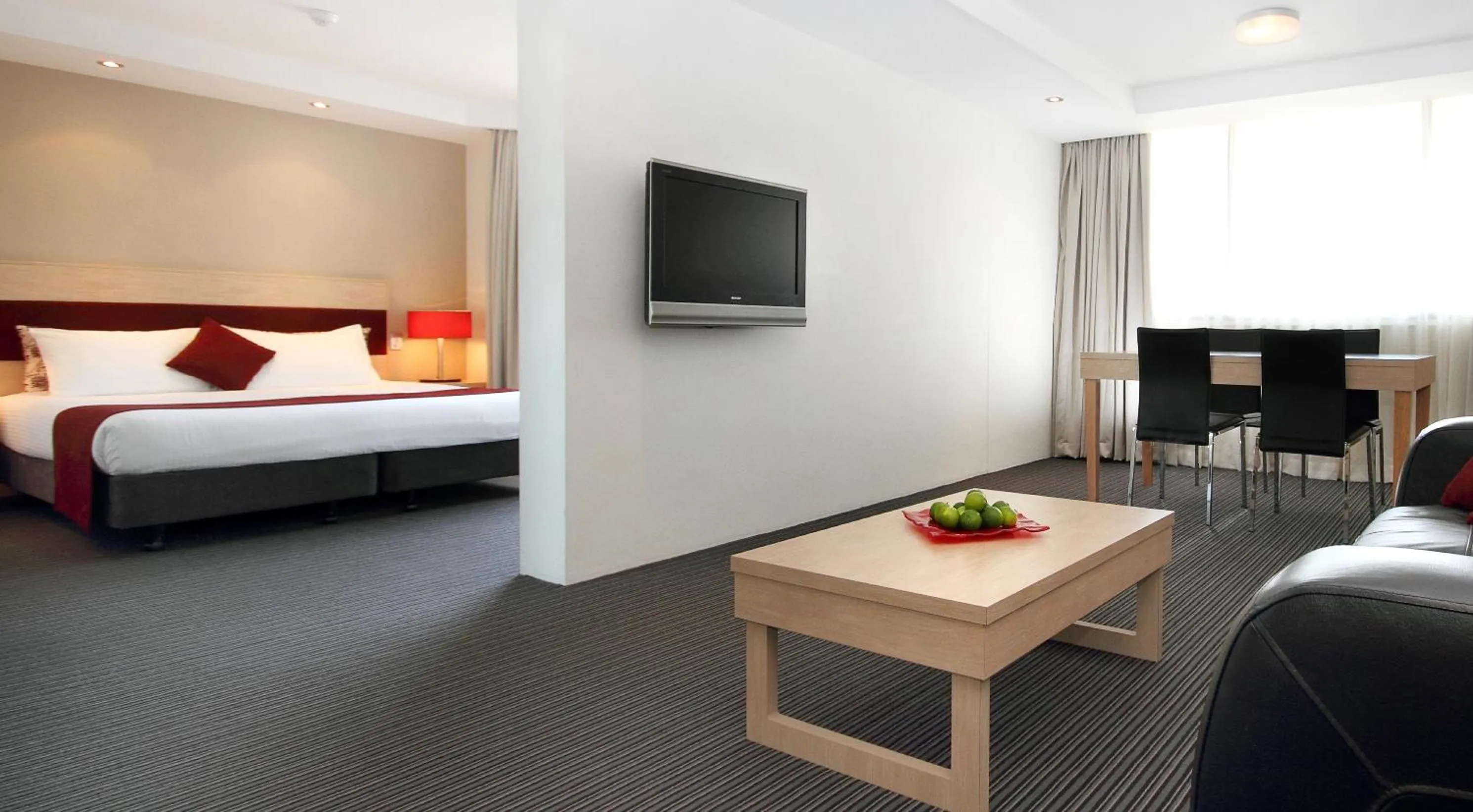 Communal lounge/ TV room, Bed in Central Studio Hotel Sydney