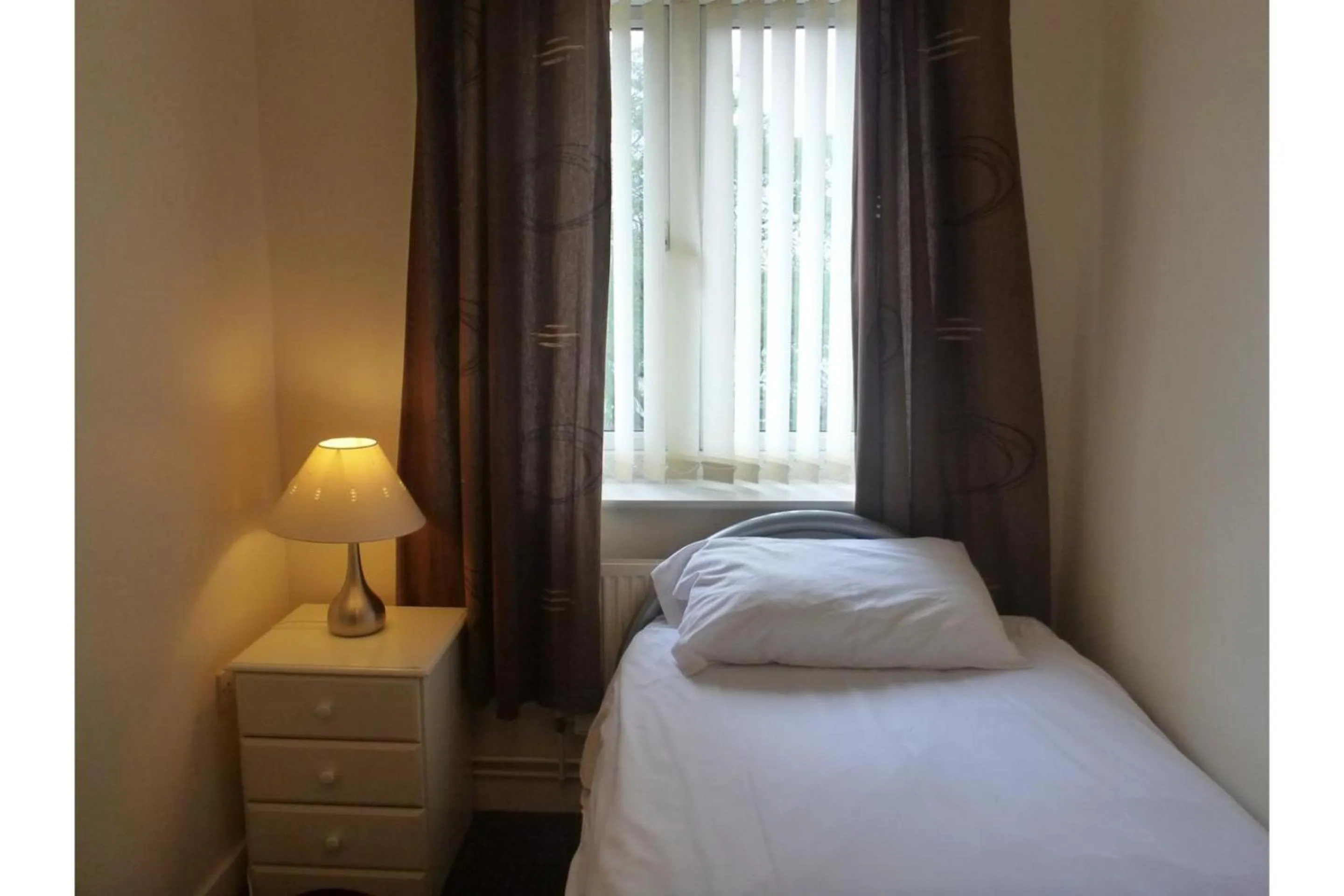 Bedroom in OYO Arinza Apartments