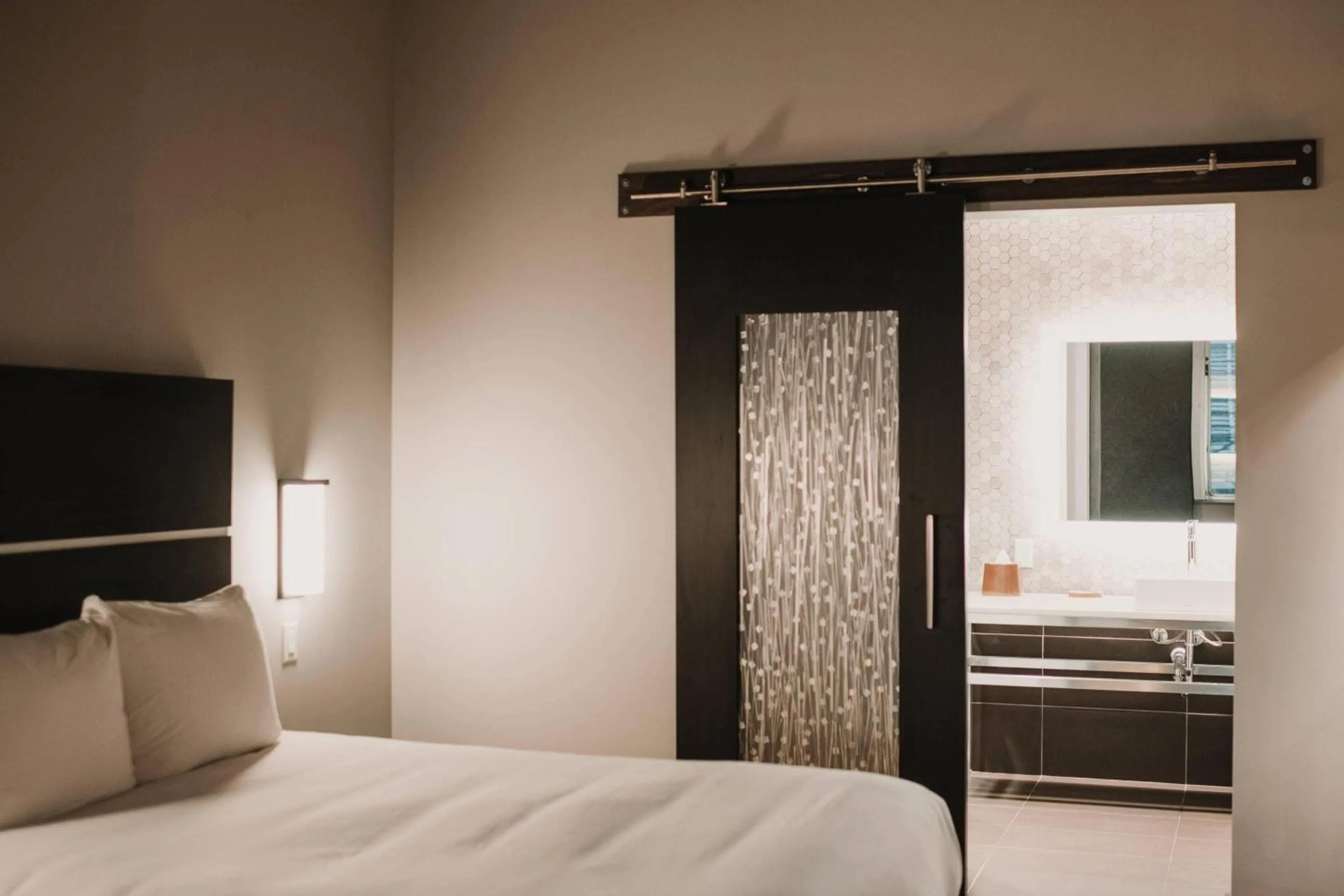 Bedroom, Bed in CityFlatsHotel - Grand Rapids, an Ascend Collection Hotel