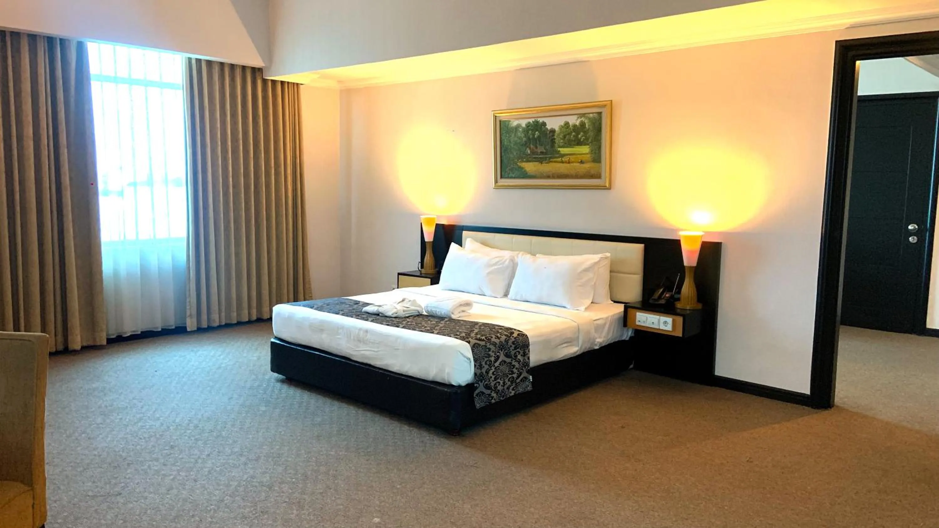 Photo of the whole room, Bed in Grand Jatra Hotel Pekanbaru