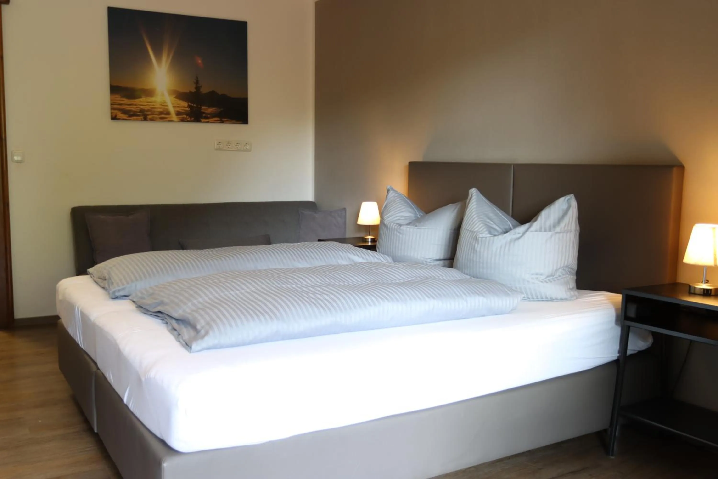 Bed in Pension Almhof Baumgarten