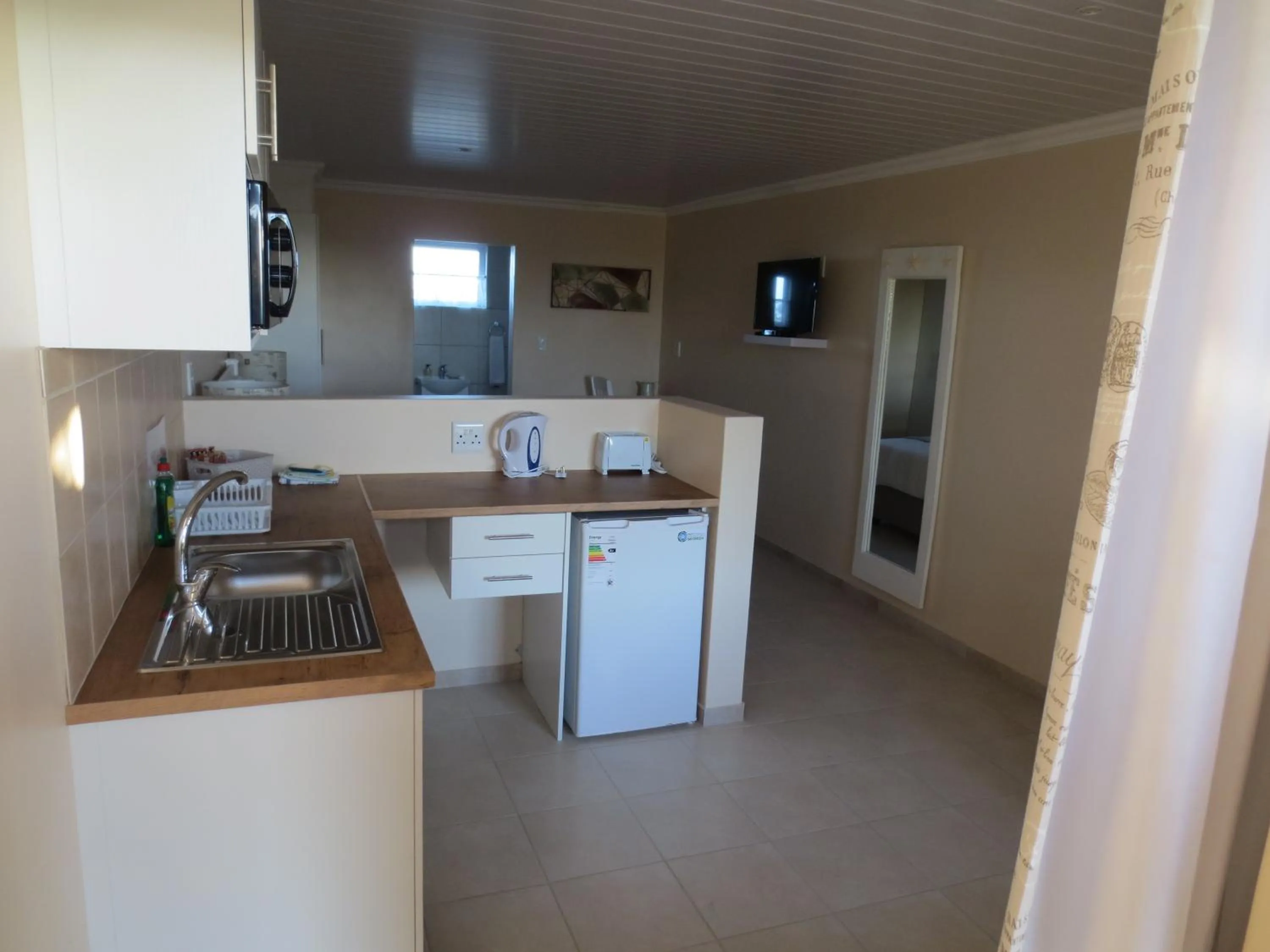 Kitchen or kitchenette in Masada Guest House