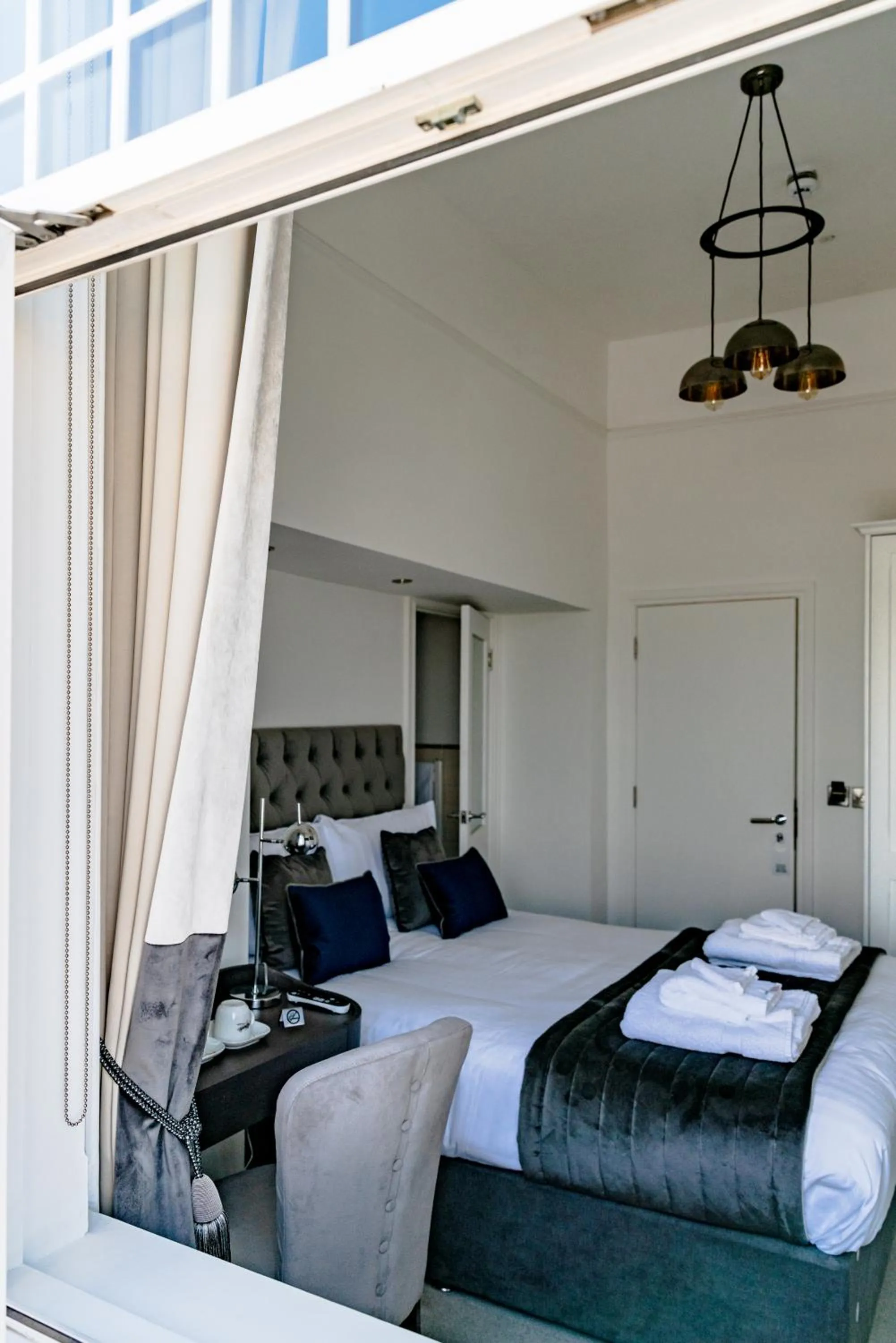 Photo of the whole room, Bed in The Strand Hotel, the former residence of Oscar Wilde