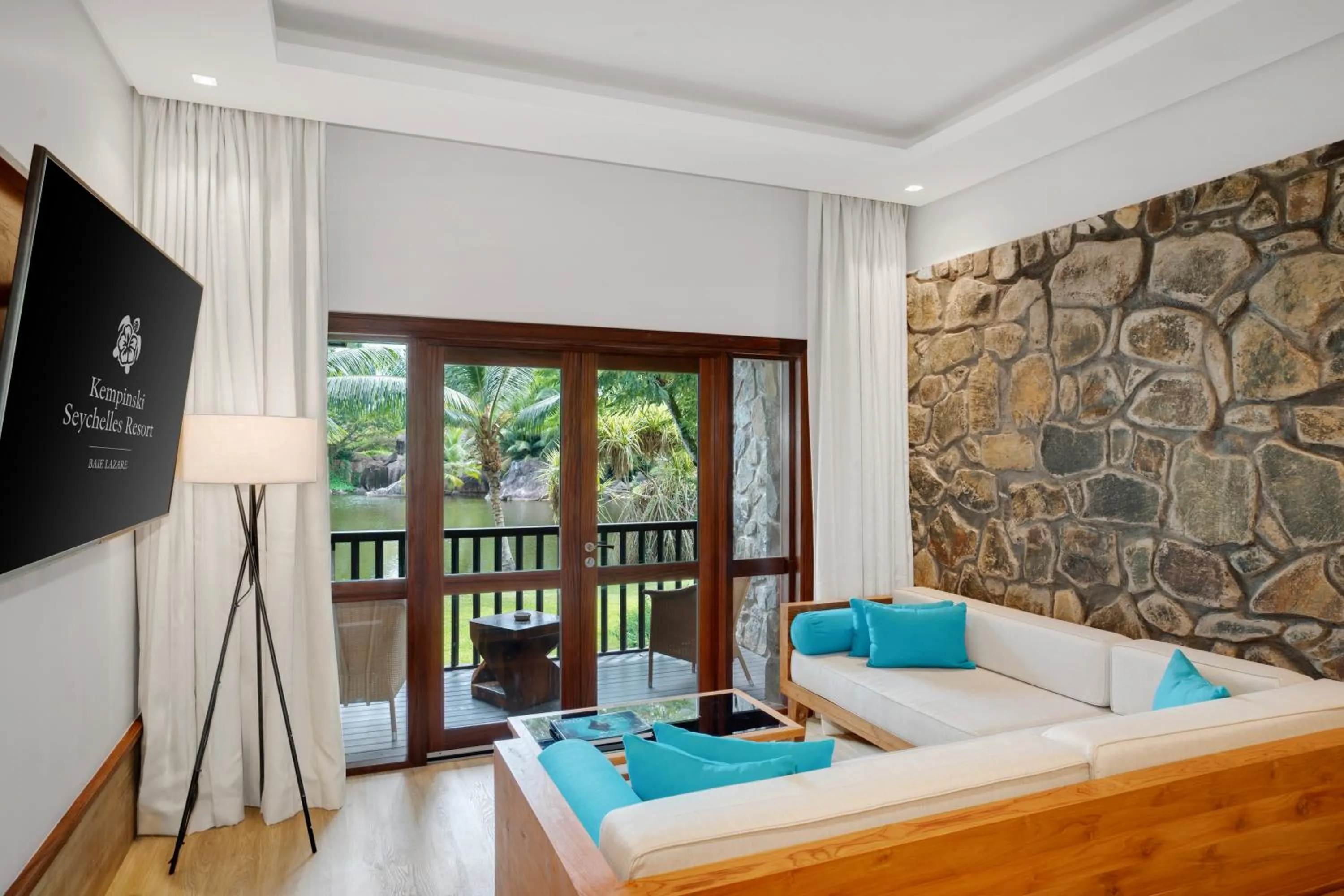 Seating area, Bed in Kempinski Seychelles Resort