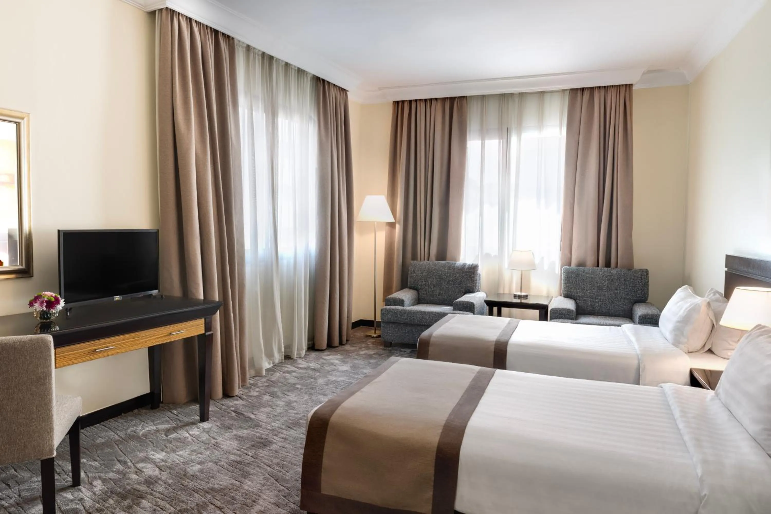 Bed in Dream City Hotel Apartments LLC