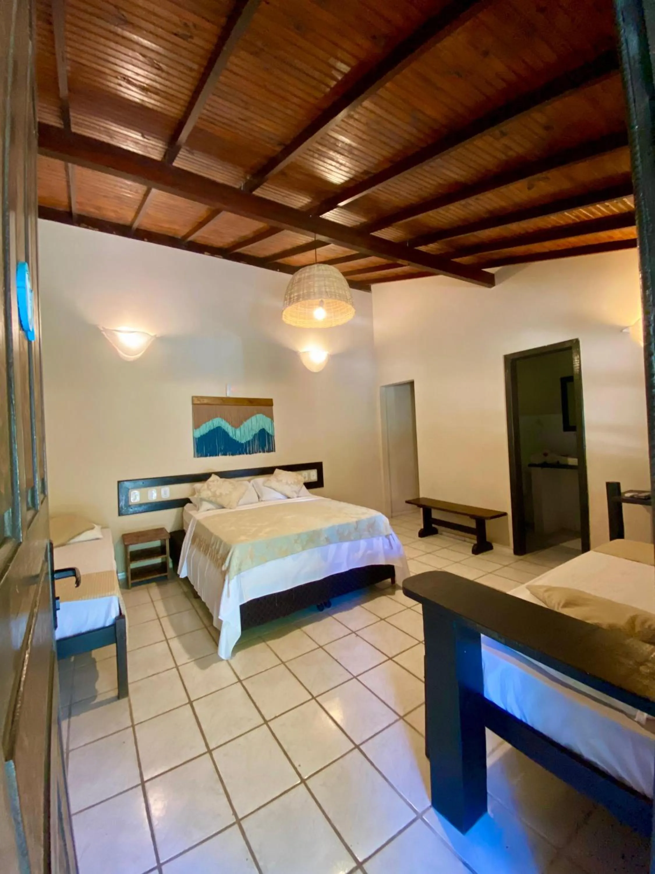 Bed in Pousada Tubarão