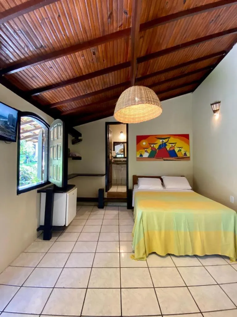 Bed in Pousada Tubarão