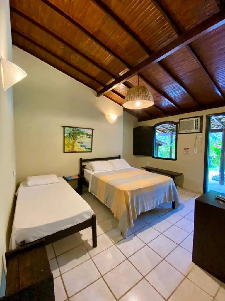 Bed in Pousada Tubarão