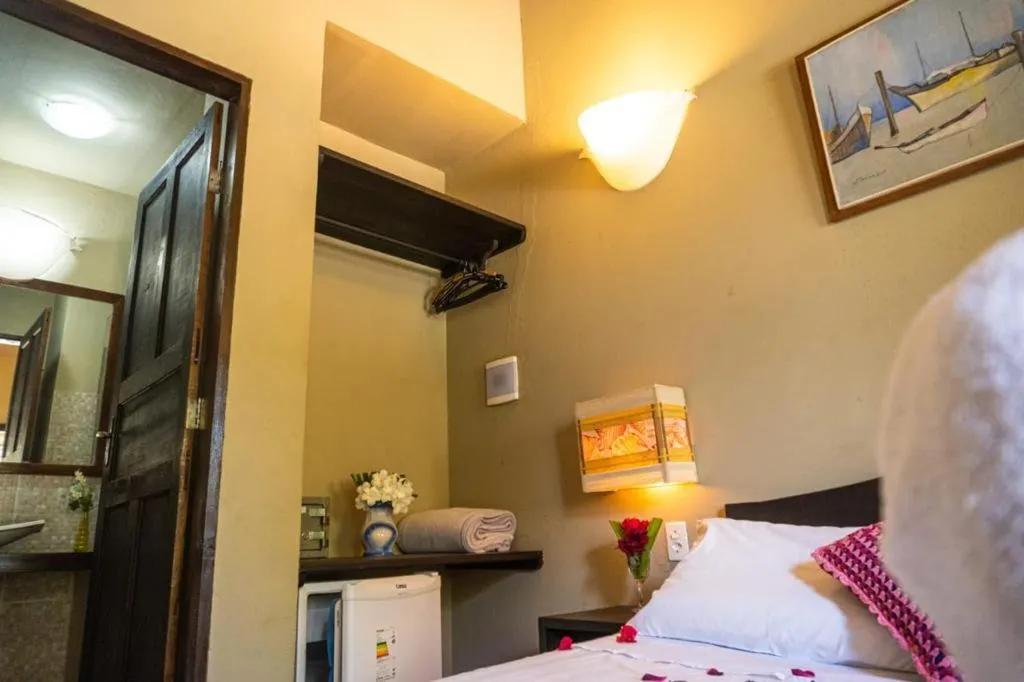 Bed in Pousada Tubarão