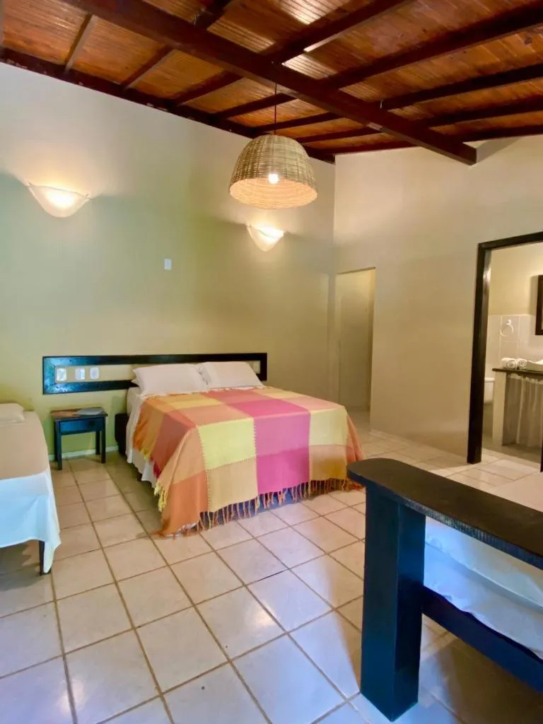 Bed in Pousada Tubarão