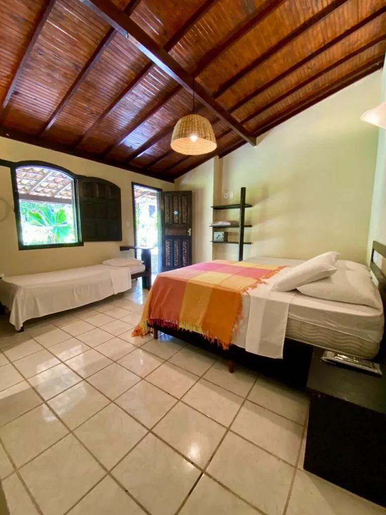 Bed in Pousada Tubarão