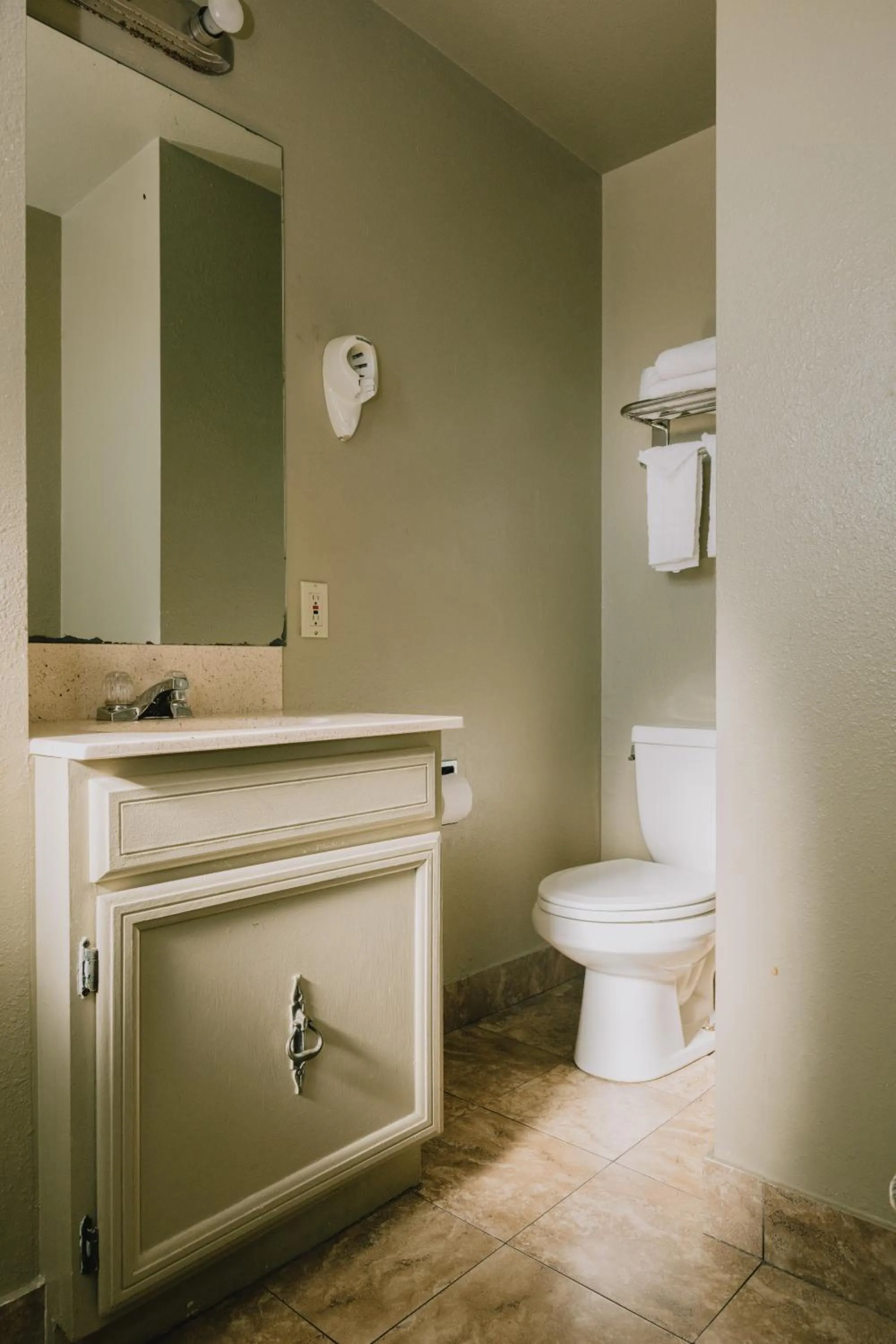 Toilet in La Hacienda Motel