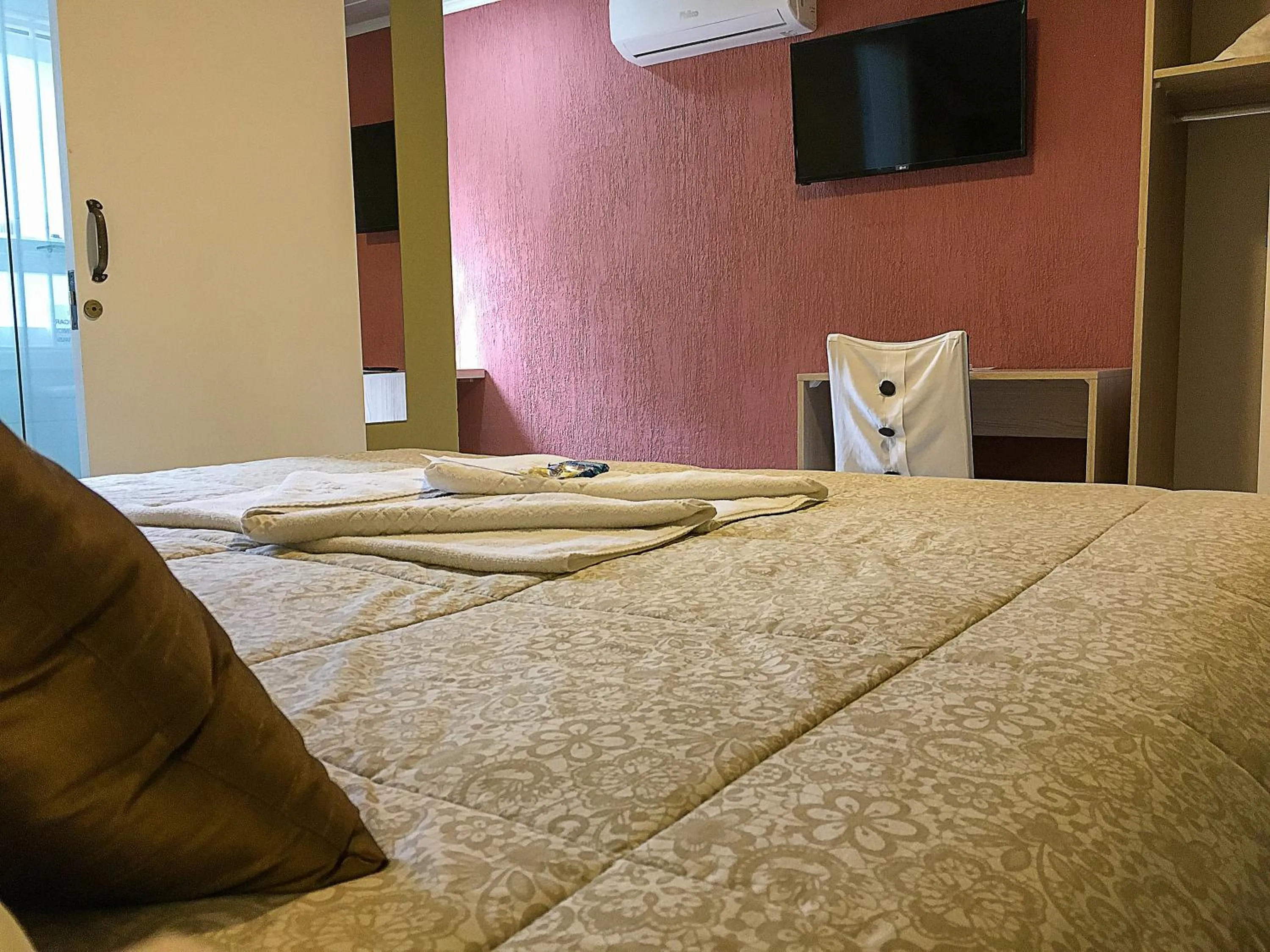 Bed in Pousada Tango