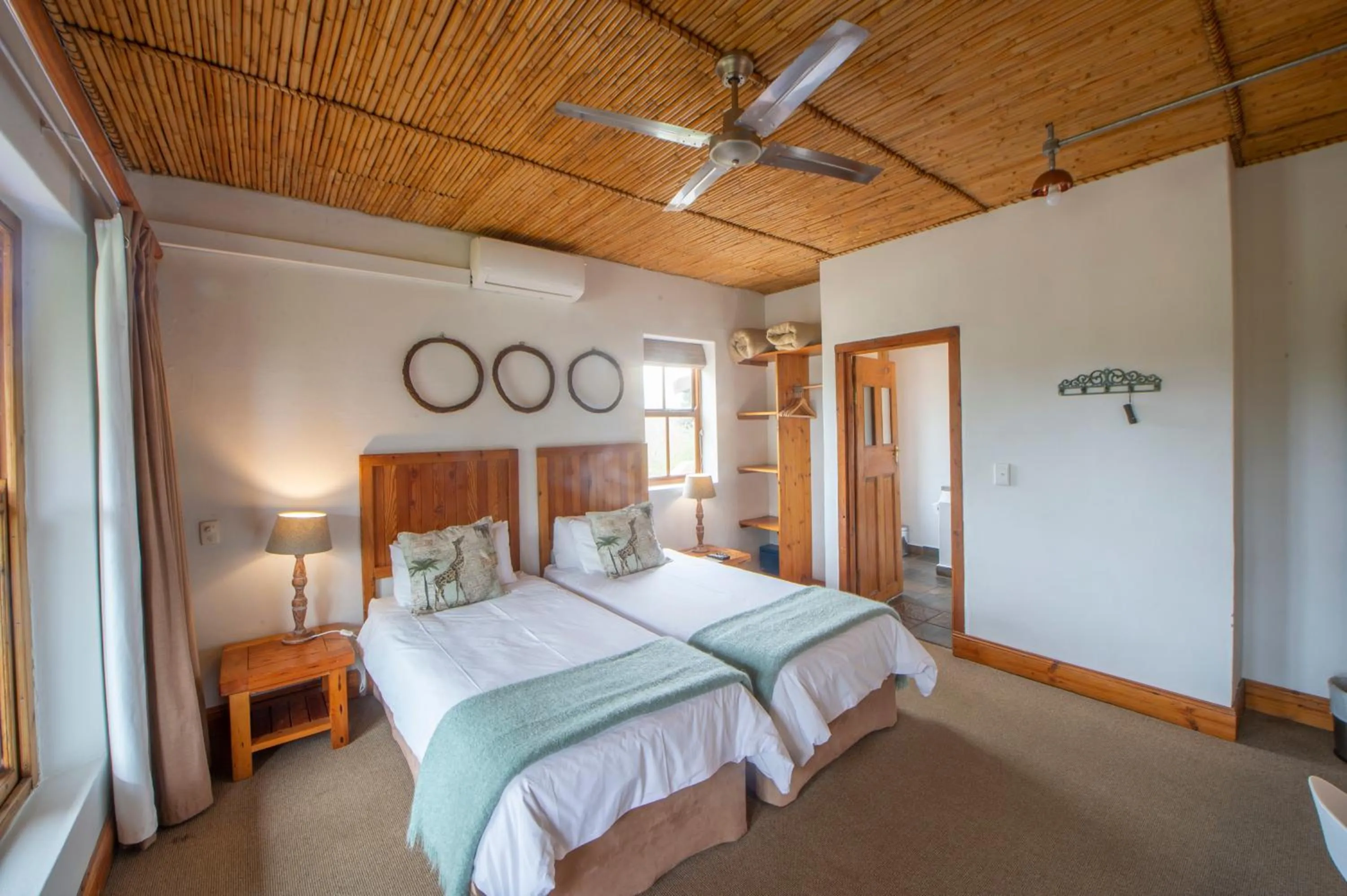 Bed in At the Woods Guest House