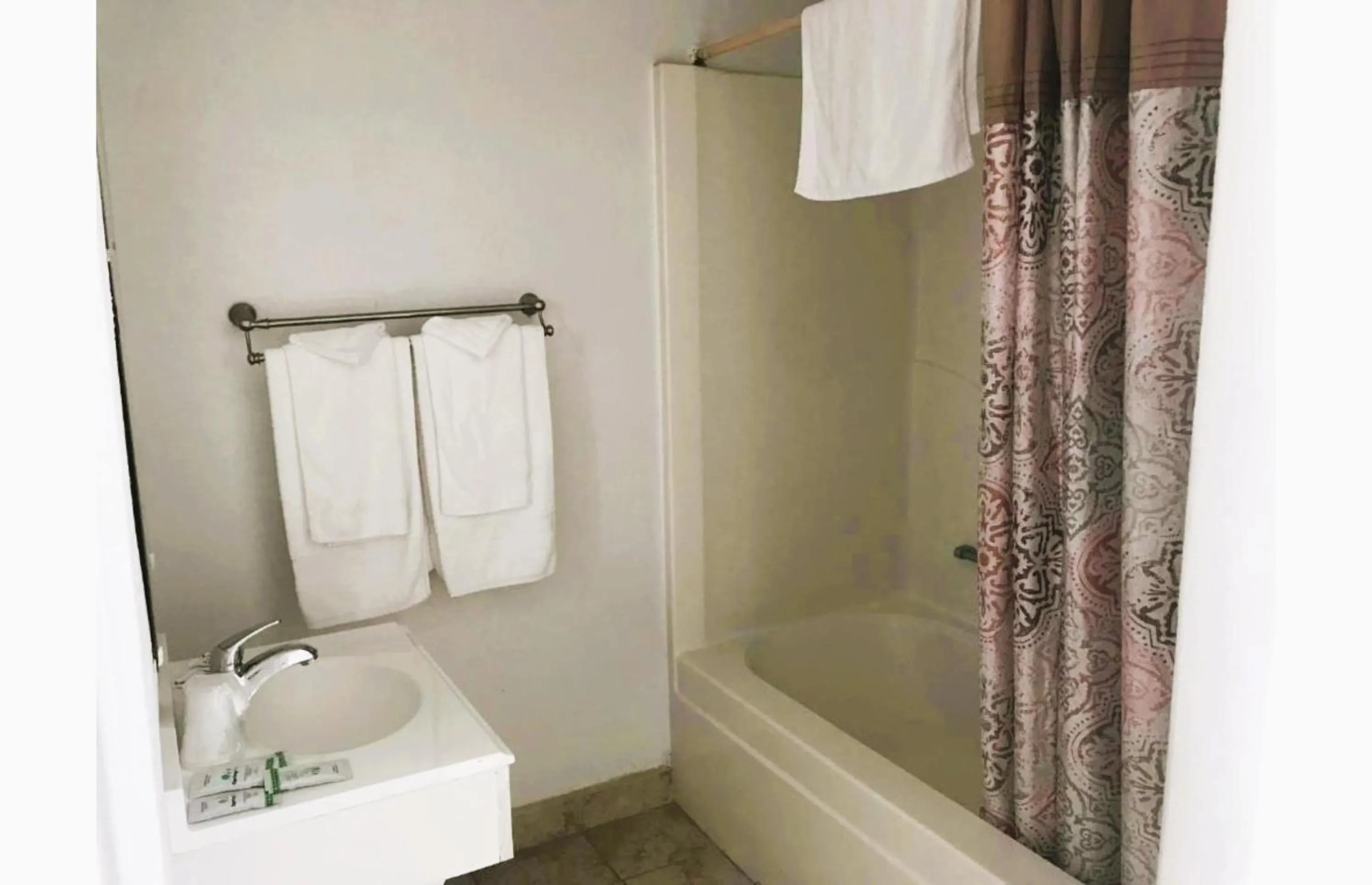 Bathroom in Royal Gateway Motel by OYO