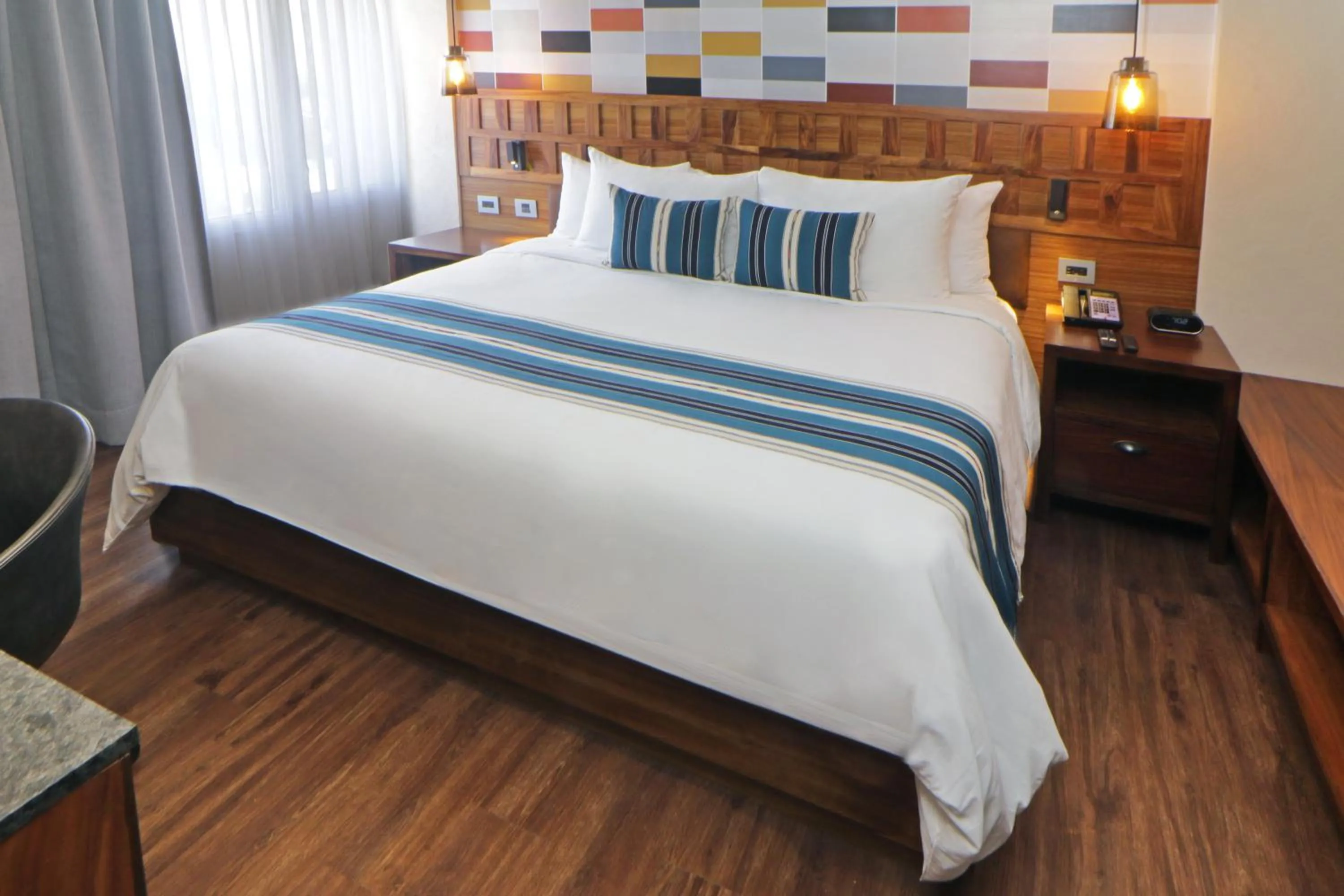 Bed in Hotel Indigo Guadalajara Expo by IHG