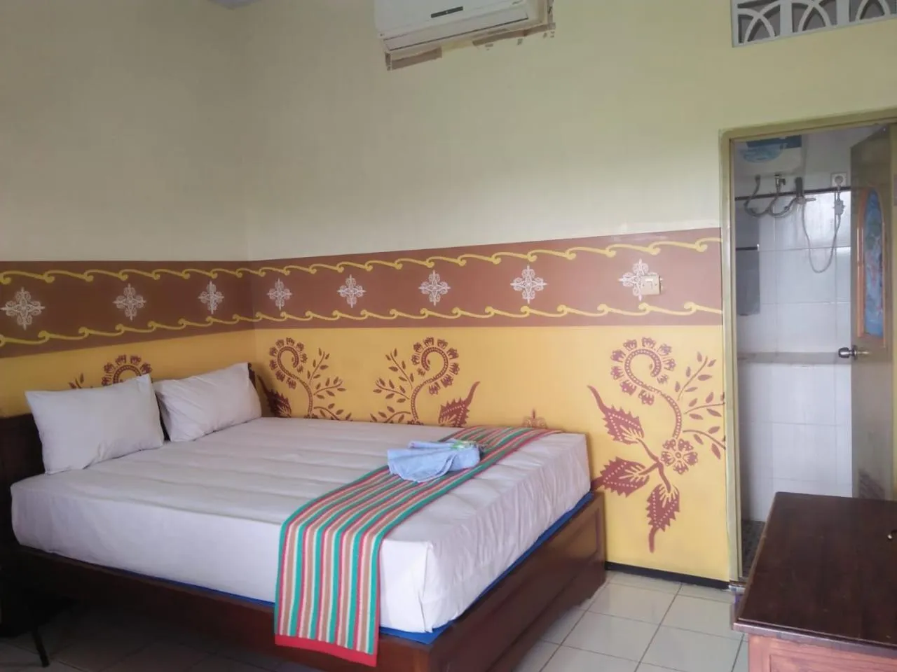 Bed in Penginapan Hotel Mangir Asri
