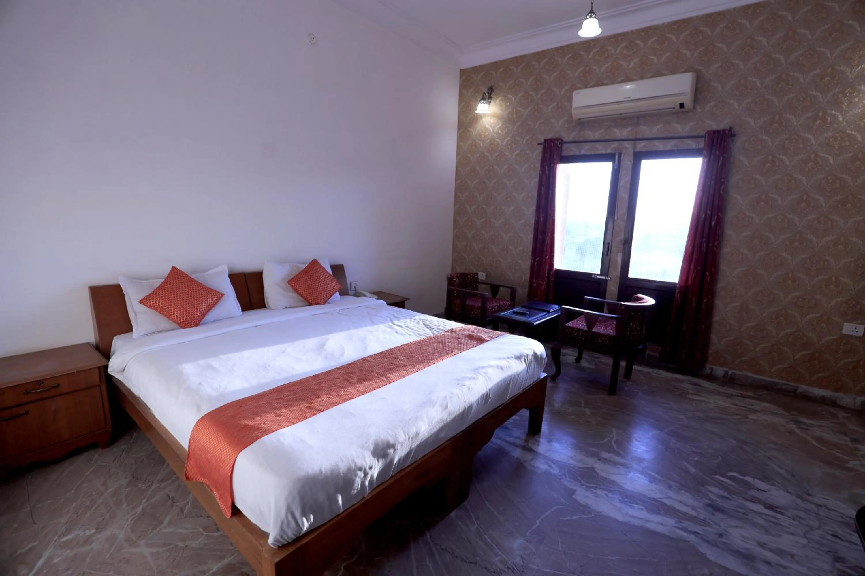 Bed in Satyam Palace Resort