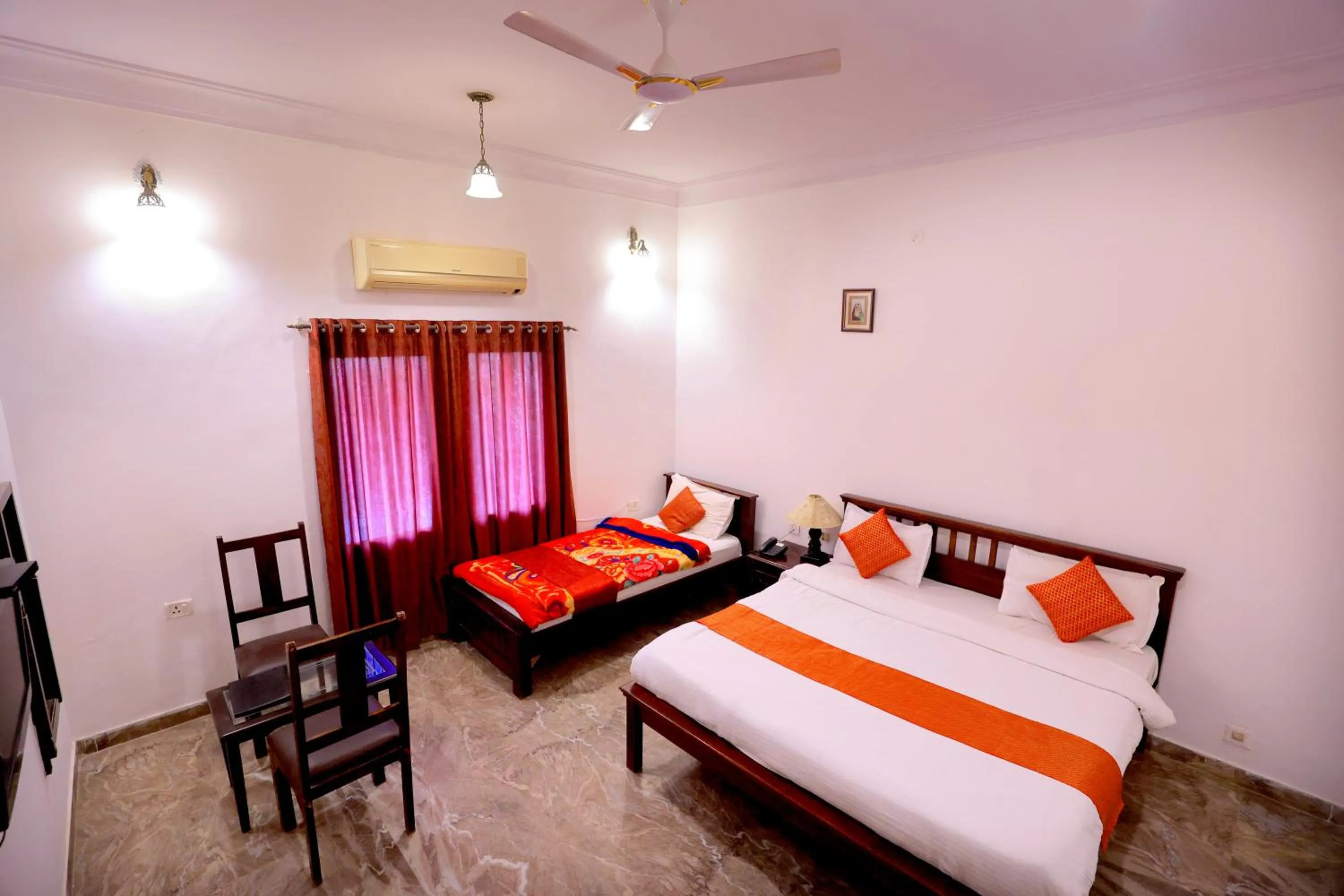 Bed in Satyam Palace Resort