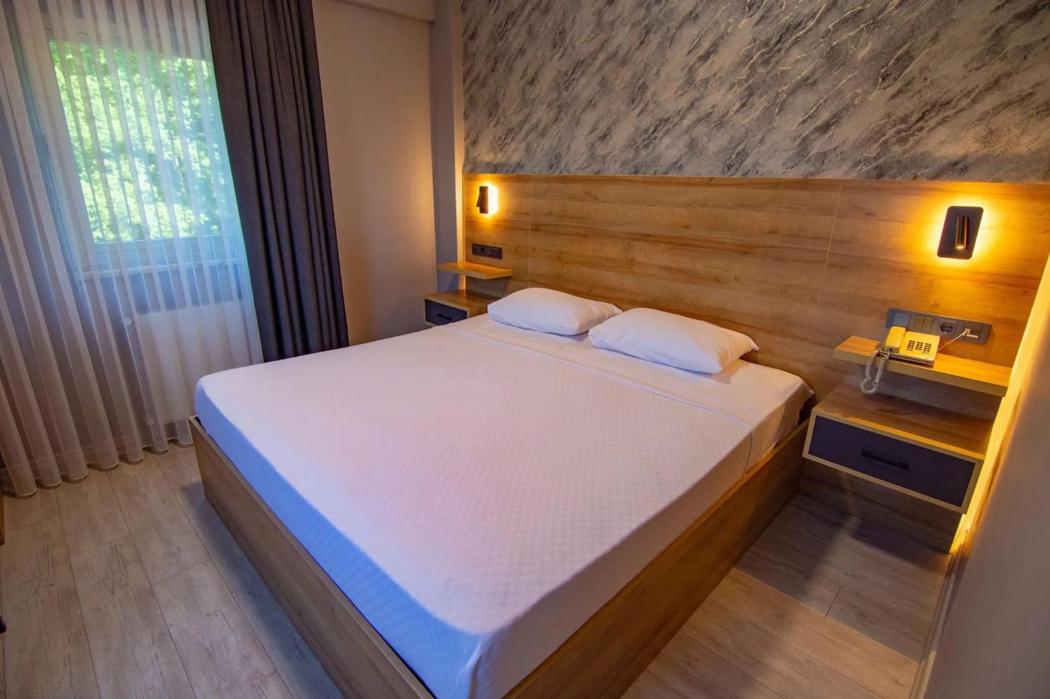 Bed in Green Palace Suite Hotel