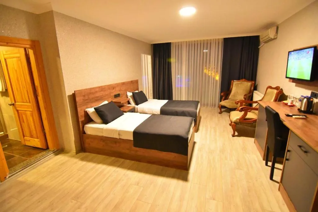 Bed in Green Palace Suite Hotel