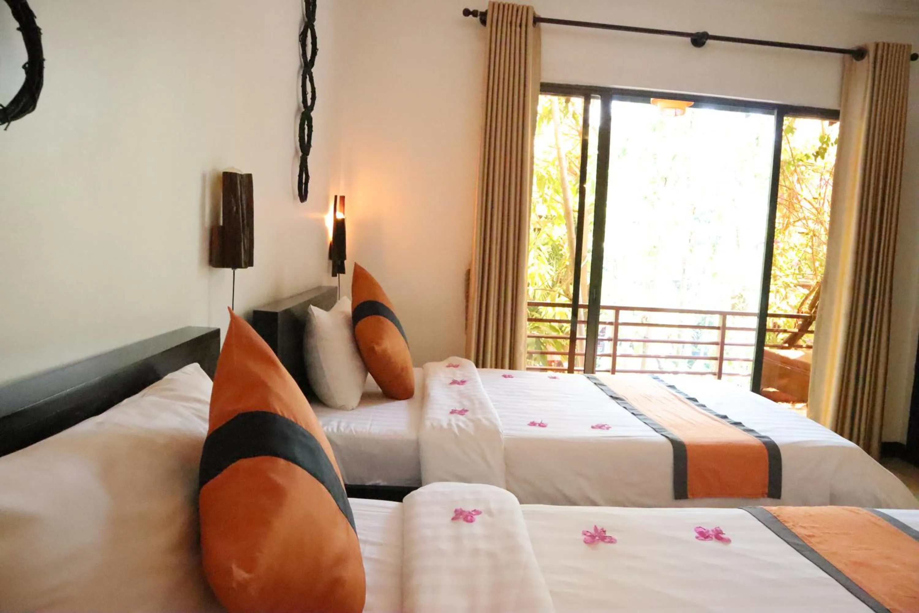 Bed in La Niche D'angkor Boutique Hotel