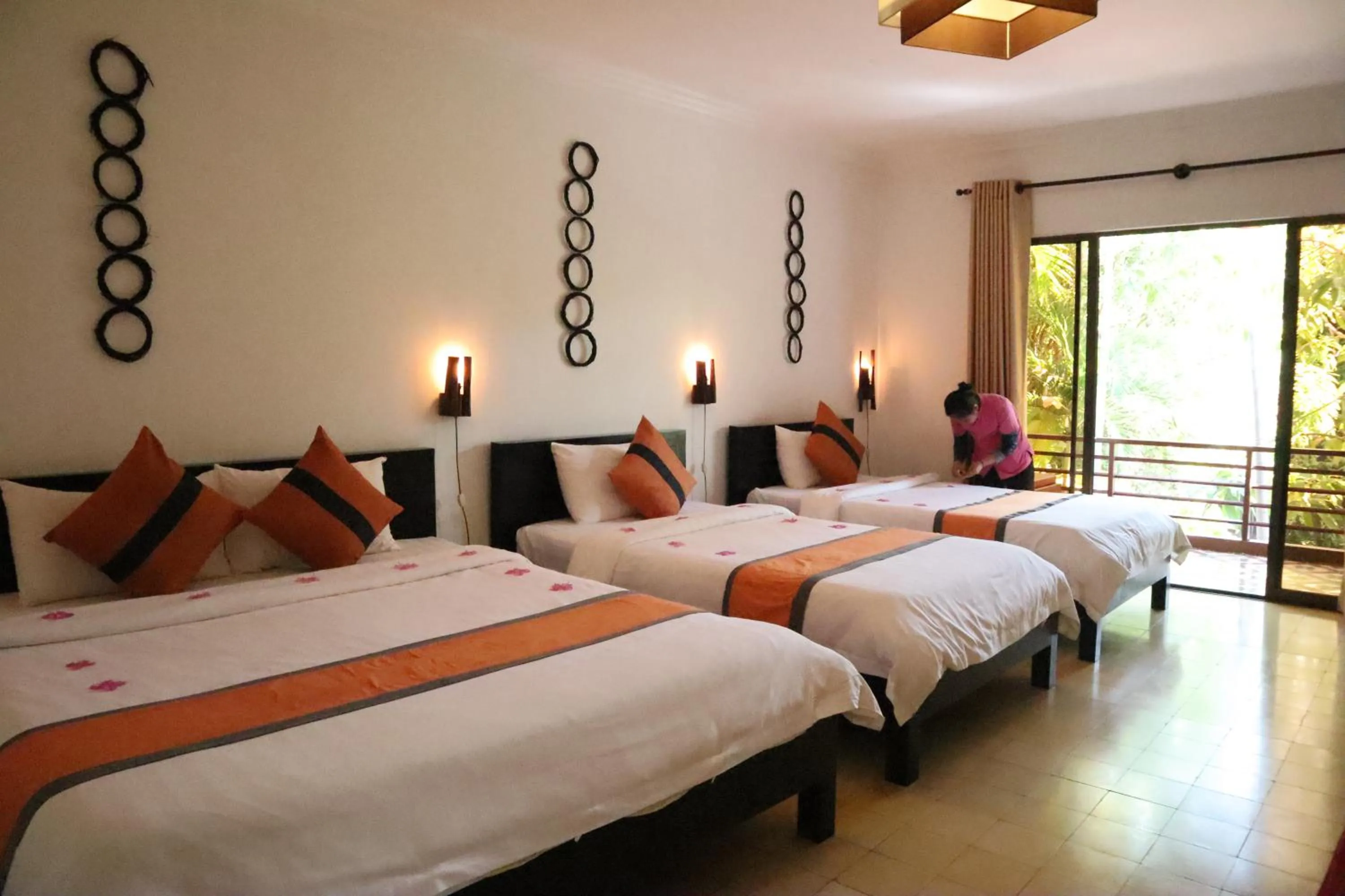 Bed in La Niche D'angkor Boutique Hotel