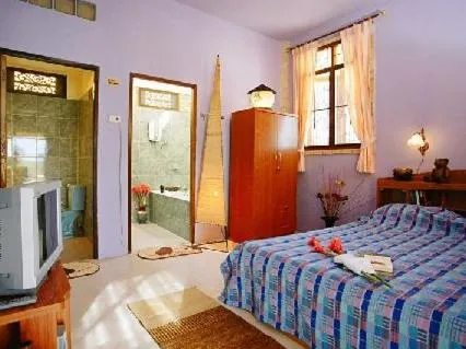 Bed in Faasai Resort & Spa