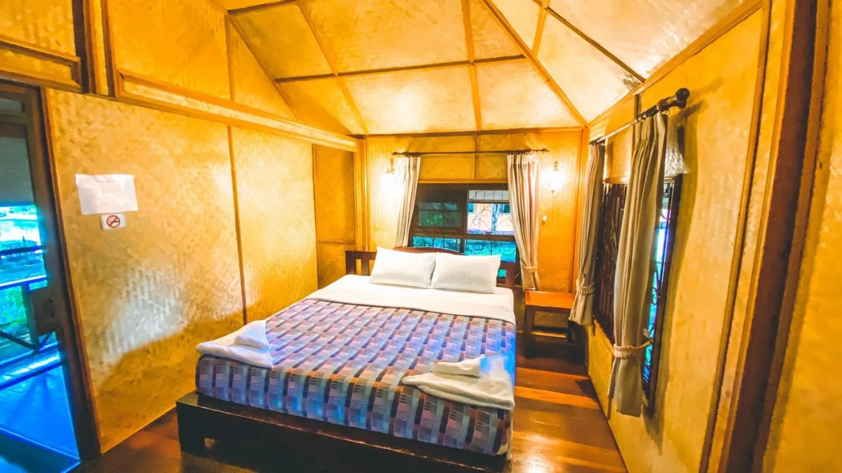 Bed in Faasai Resort & Spa