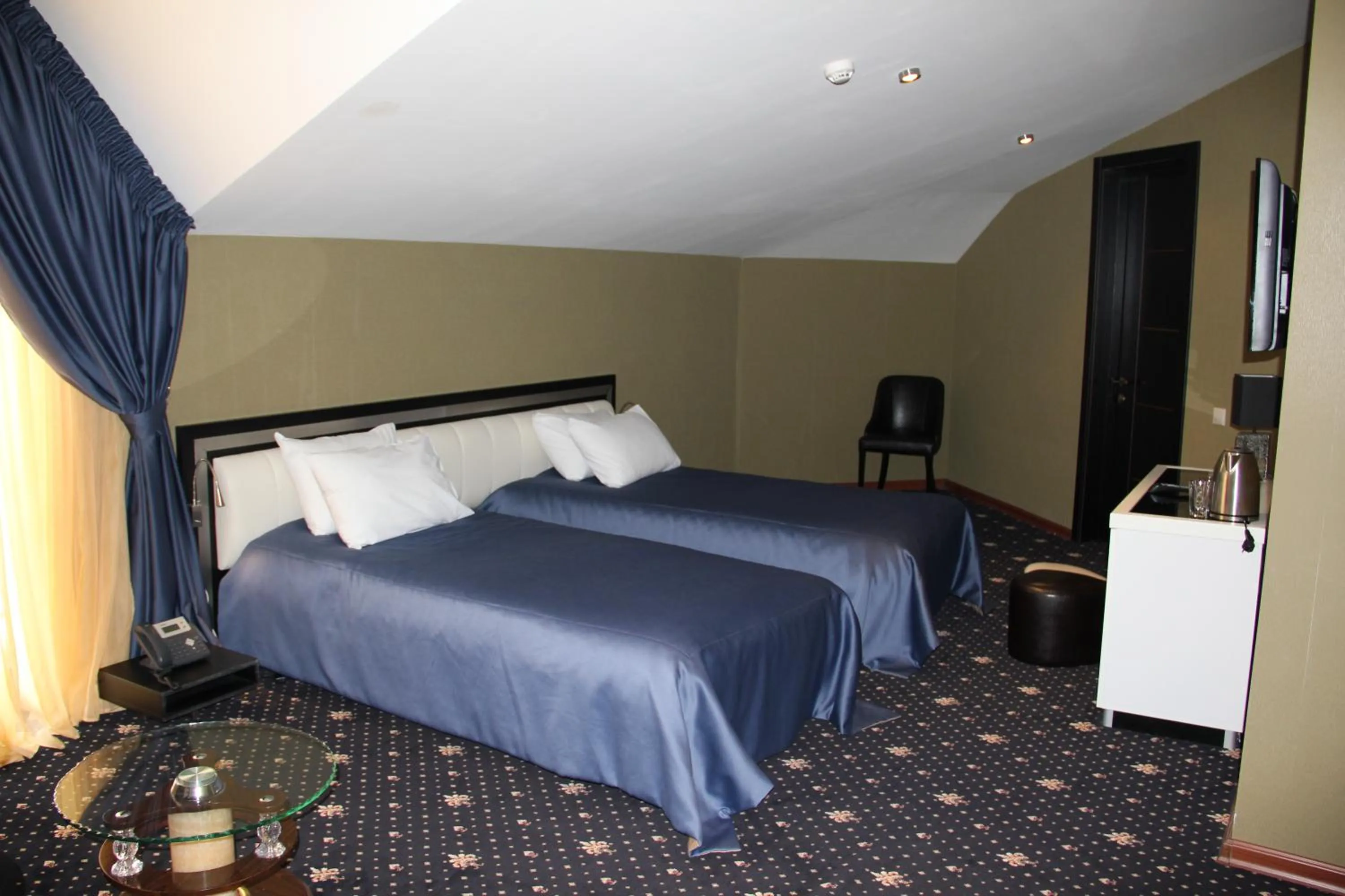 Bed in Hotel Villa Palace