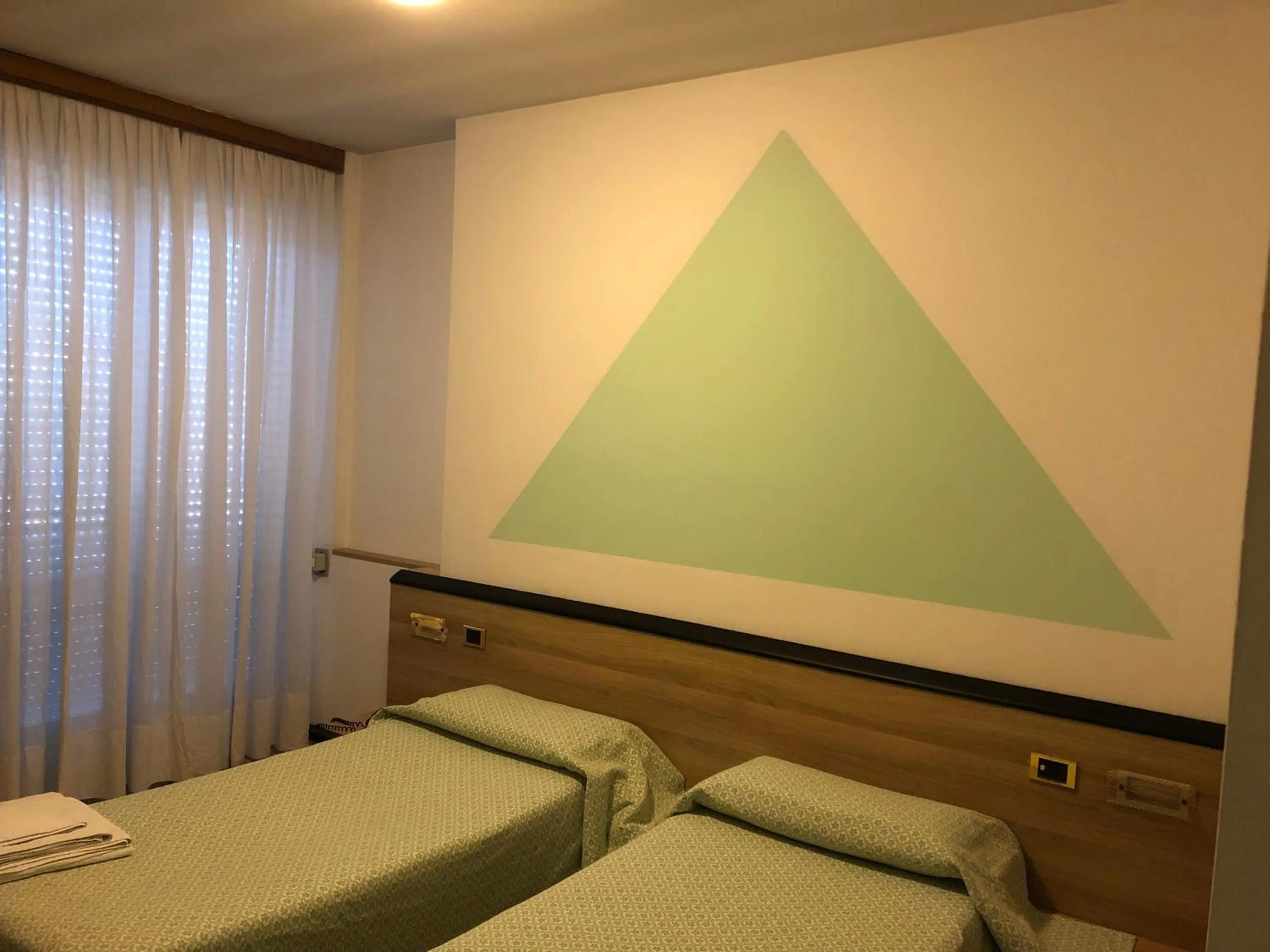 Bed in Hotel Roma