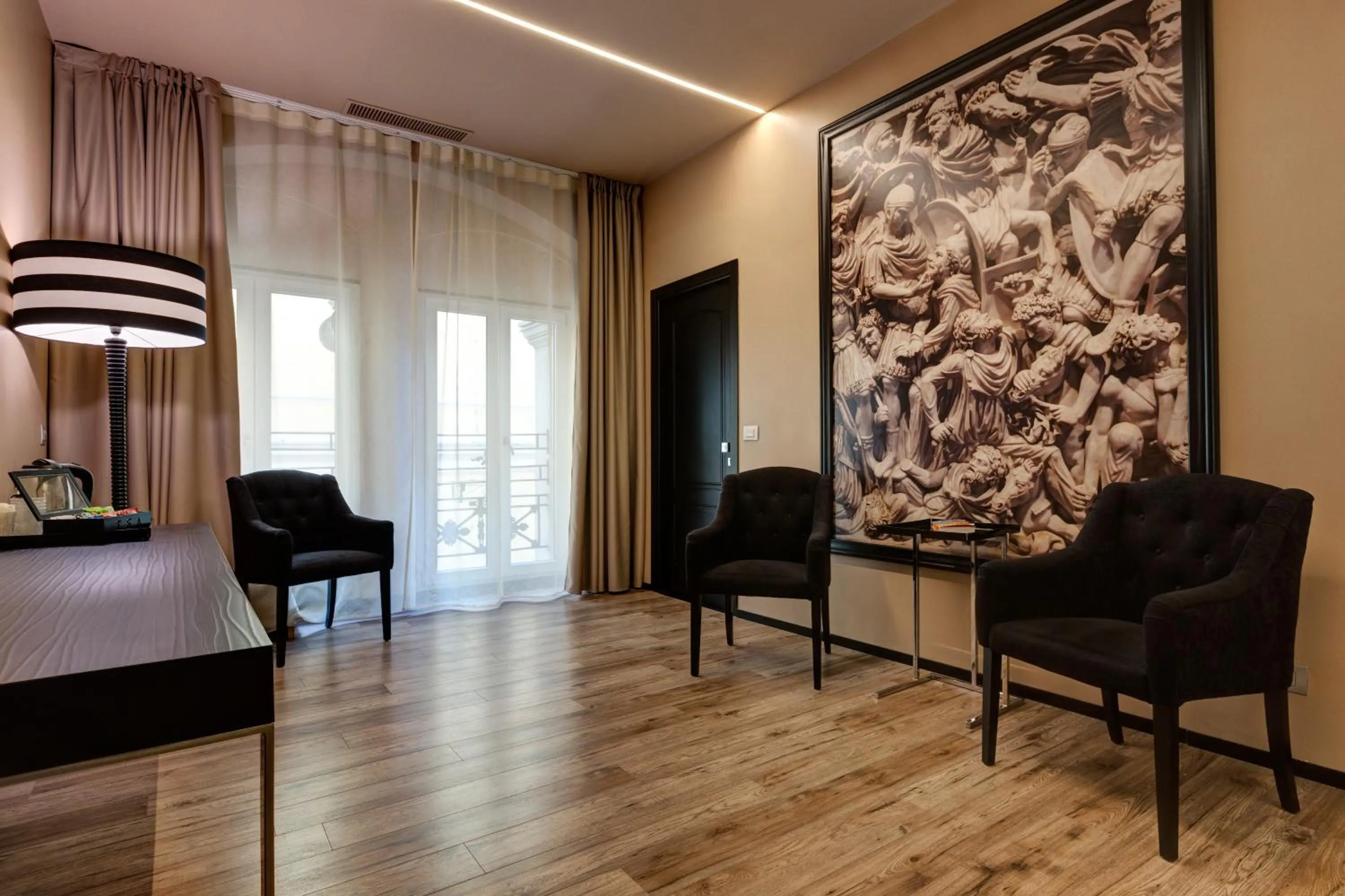 Communal lounge/ TV room, Bed in Dharma Luxury Hotel