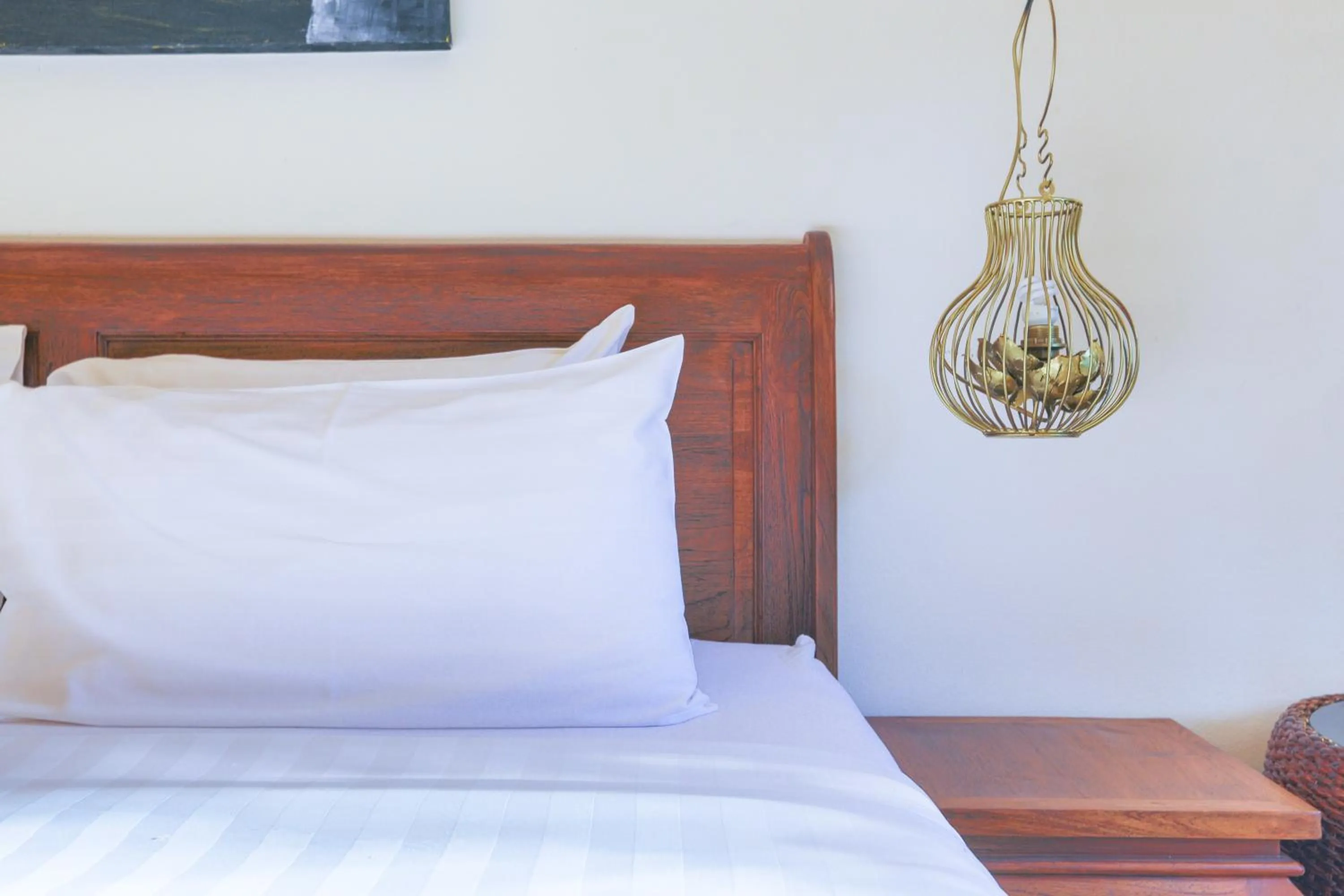 Bed in Pa Prai Villas and Suites Resort