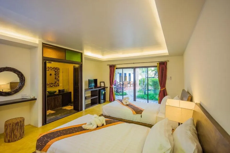 Bed in Pa Prai Villas and Suites Resort