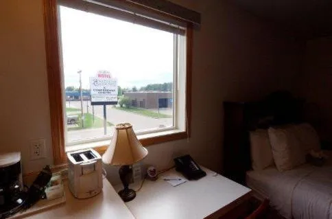 Bed in Executive House Suites Hotel & Conference Centre