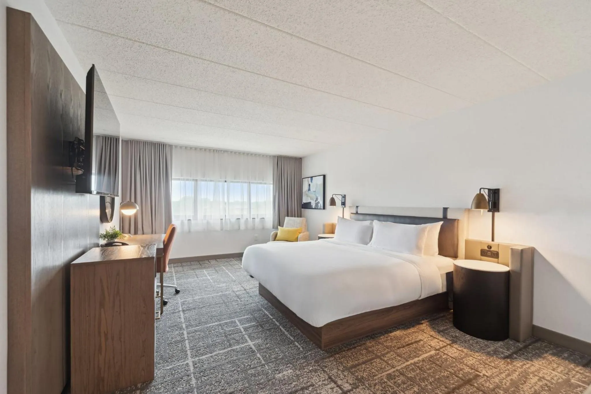 Photo of the whole room, Bed in Crowne Plaza Lansing by IHG