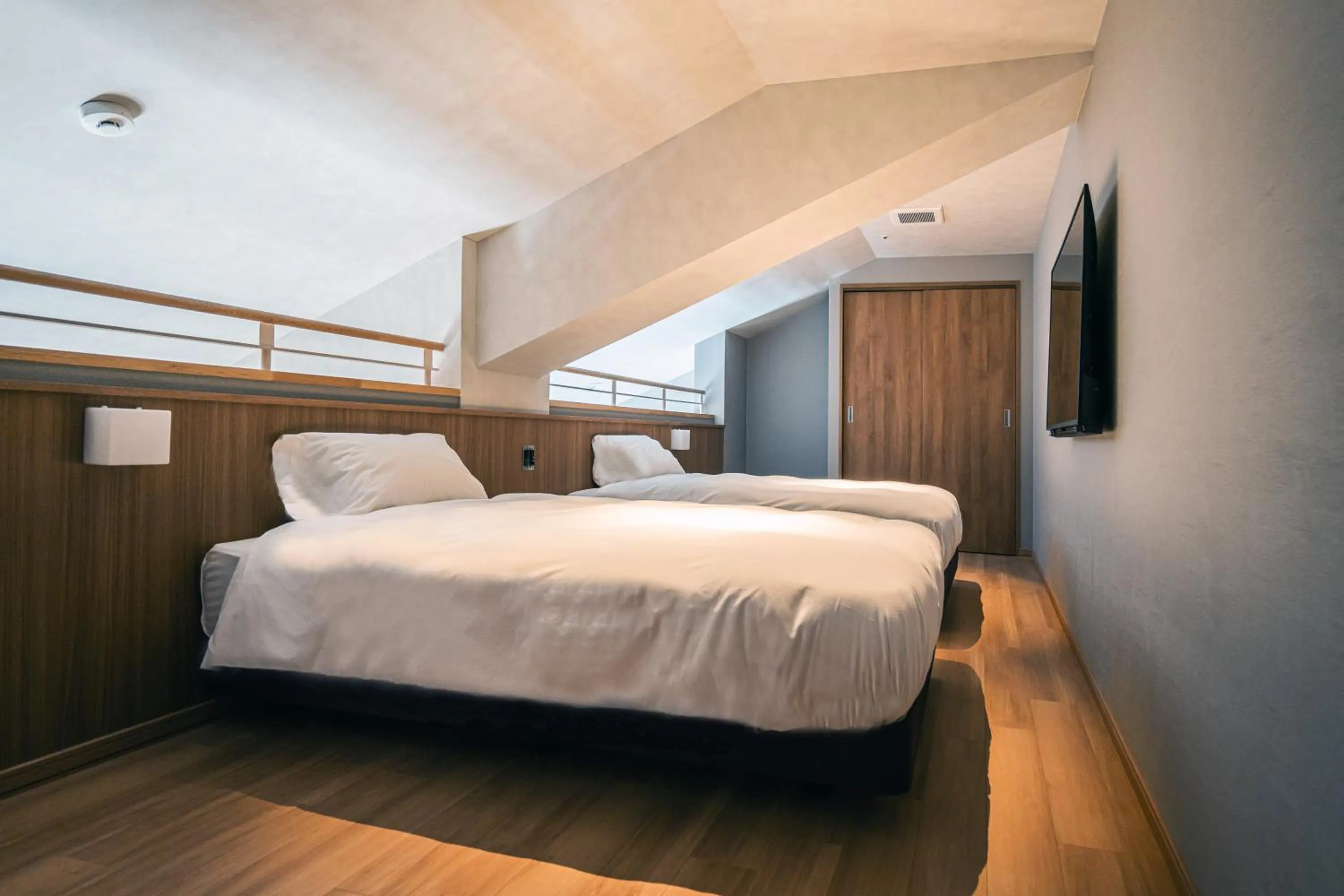 Bedroom, Bed in Higashikawa Asahidake Onsen Hotel Bear Monte