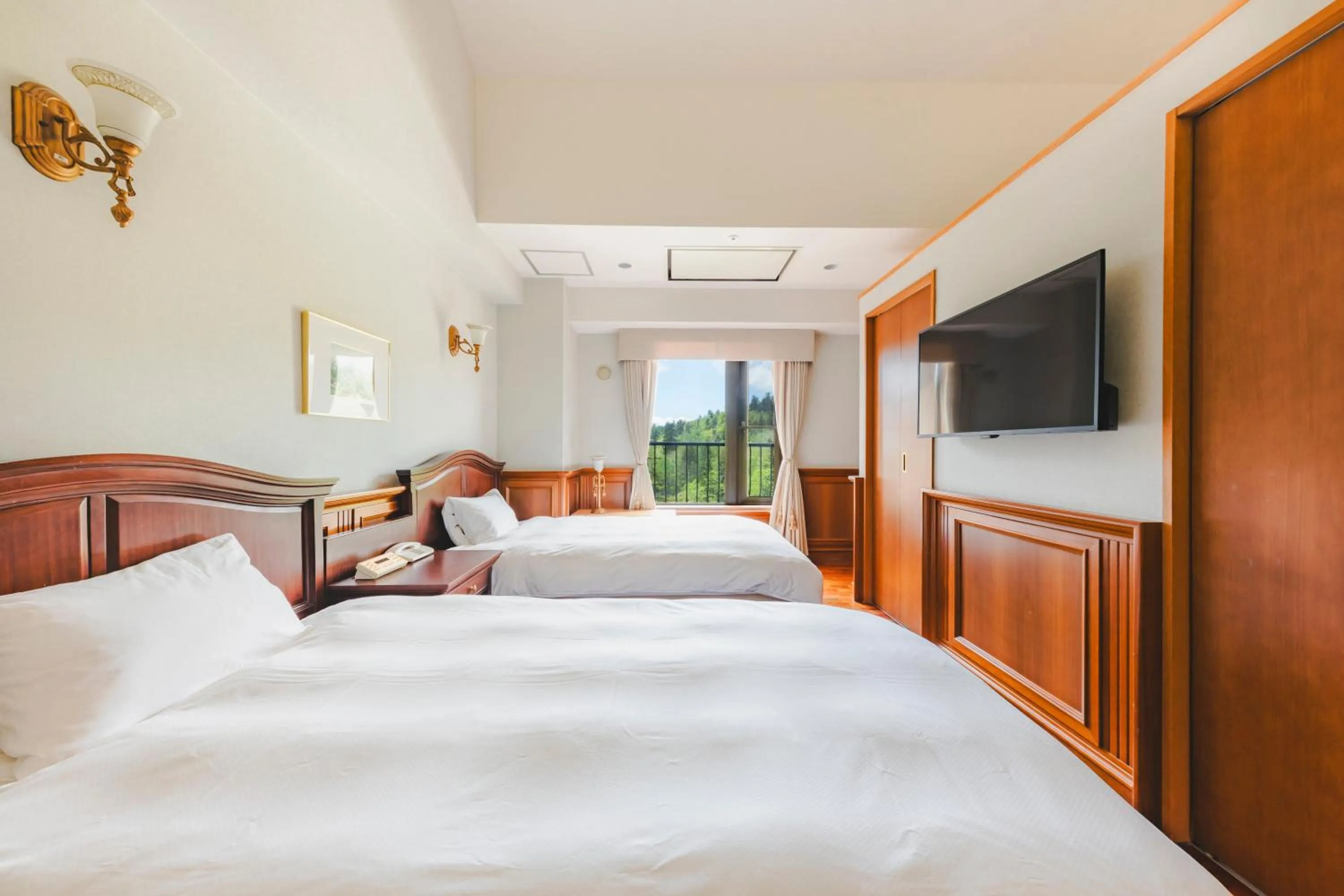 Bedroom, Bed in Higashikawa Asahidake Onsen Hotel Bear Monte