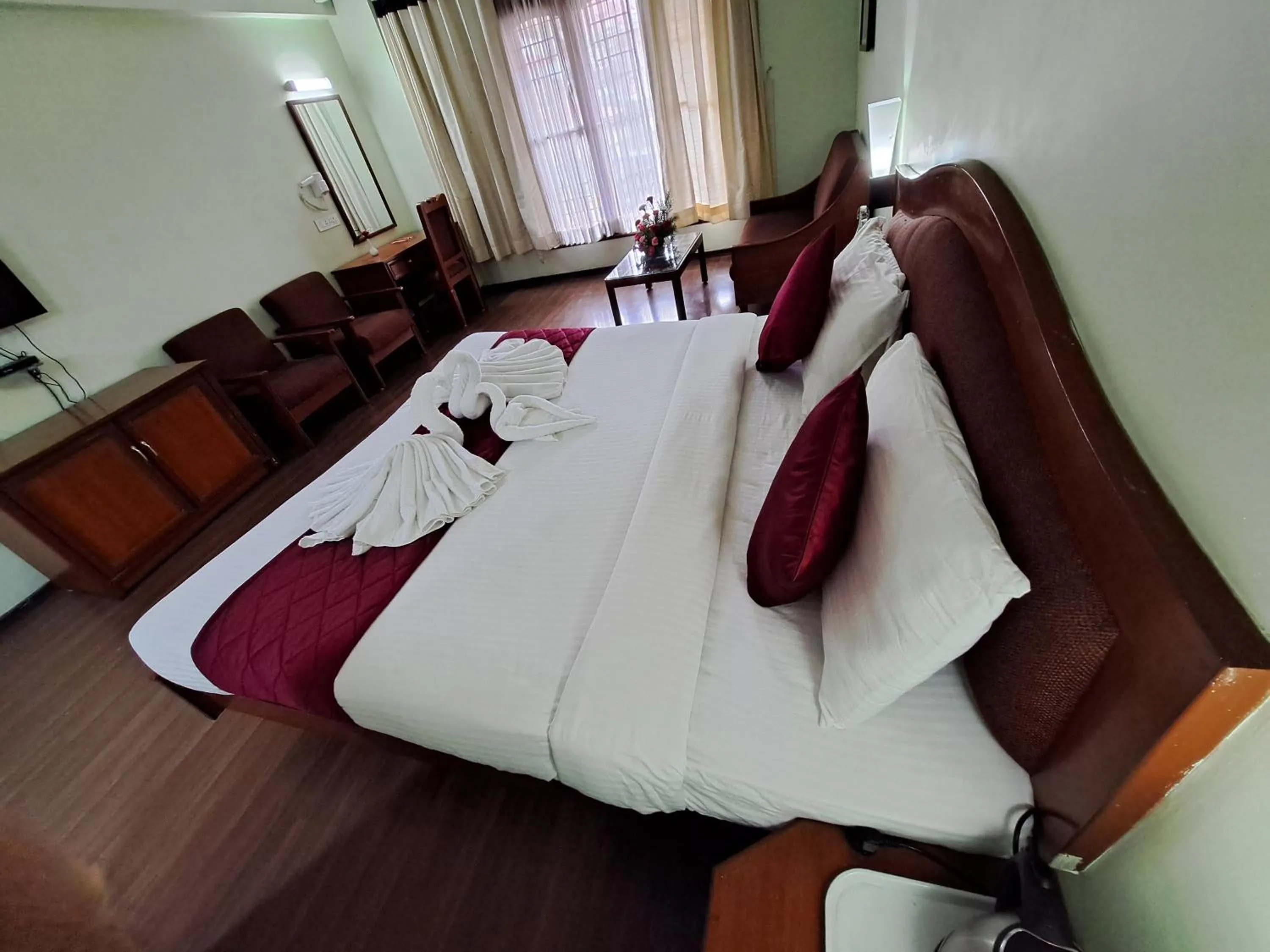 Bed in Hotel Preethi Classic Towers