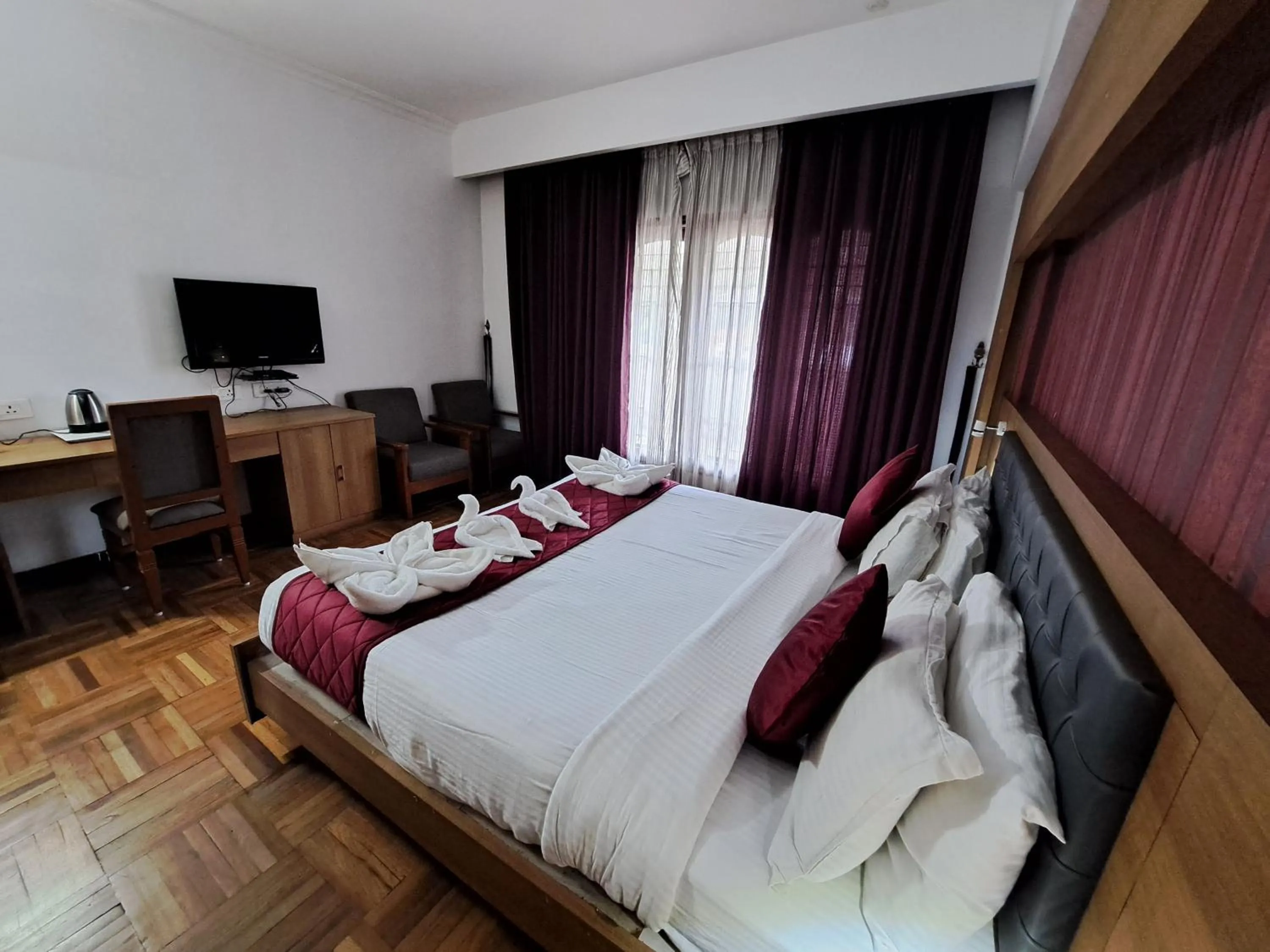 Bed in Hotel Preethi Classic Towers